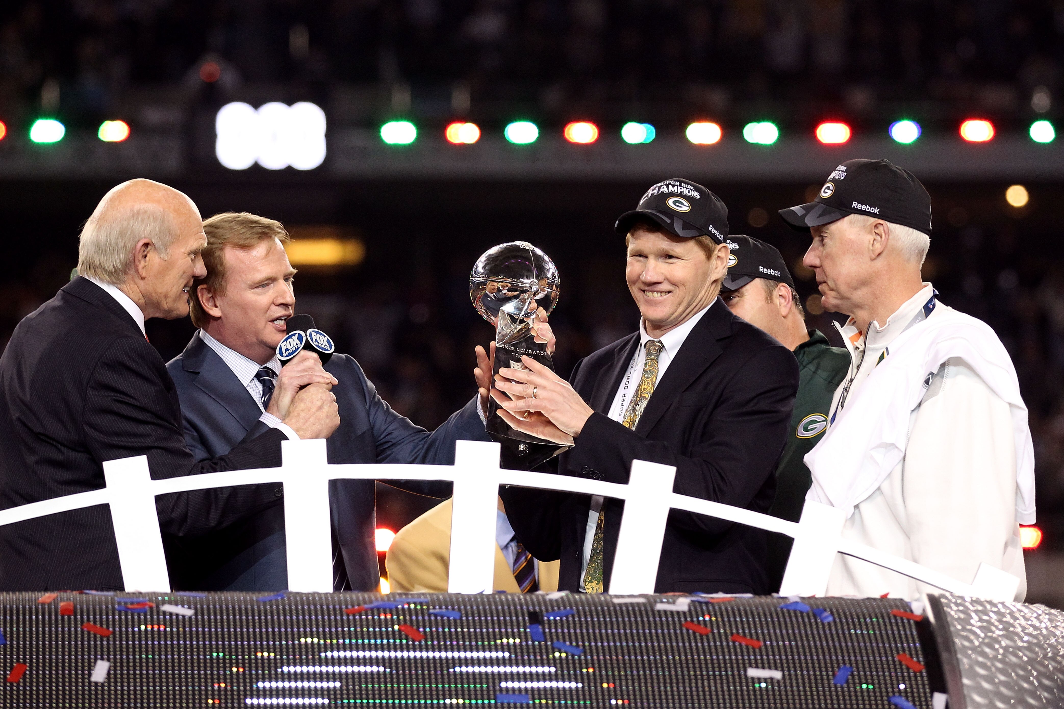 ARLINGTON, TX - FEBRUARY 06:  President and CEO of the Green Bay Packers Mark Murphy holds up the Vince Lombardi Trophy after winning Super Bowl XLV against the Pittsburgh Steelers 31-25 as Green Bay Packers General Manager Ted Thompson and NFL Commission