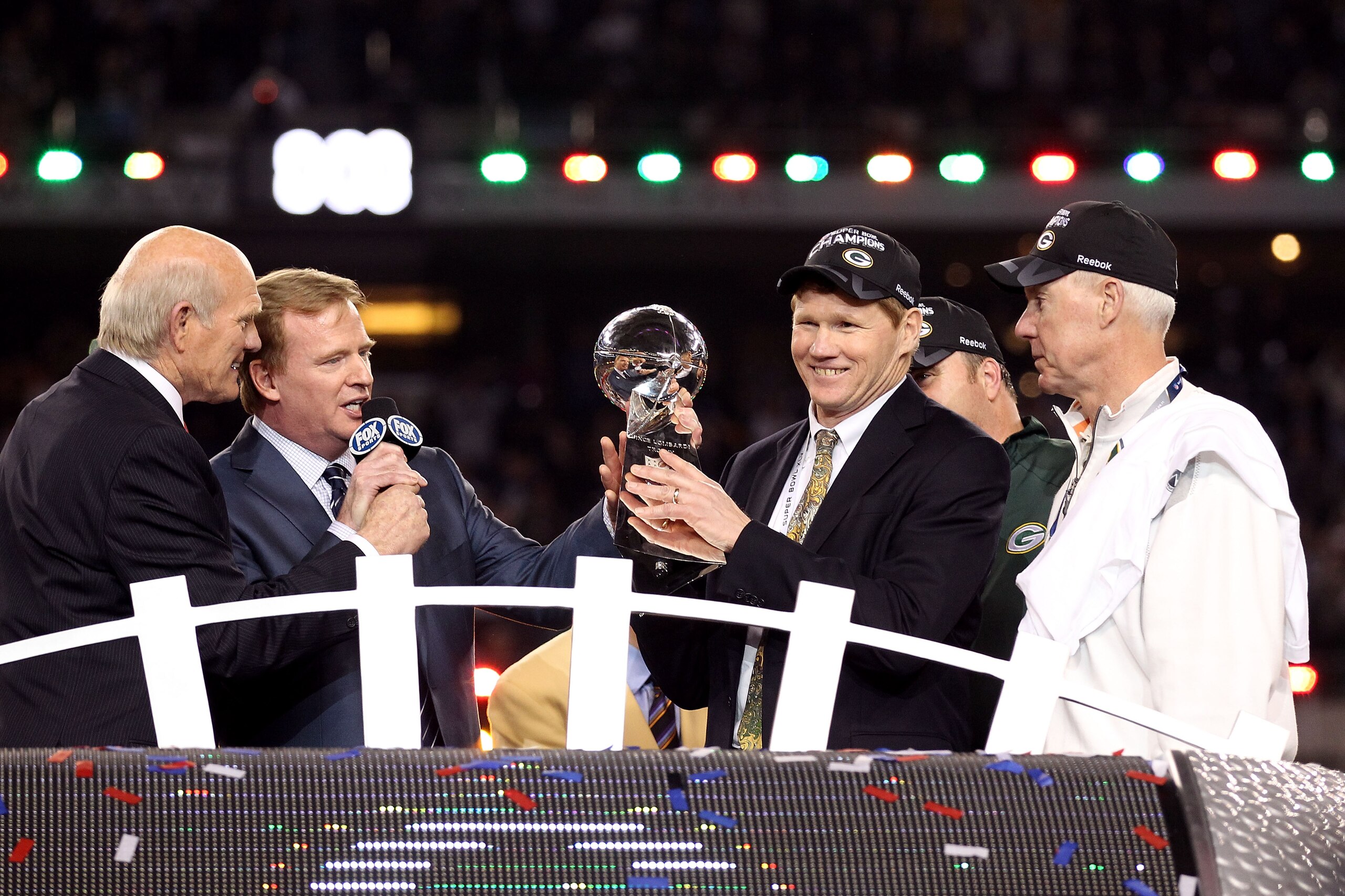 ARLINGTON, TX - FEBRUARY 06:  President and CEO of the Green Bay Packers Mark Murphy holds up the Vince Lombardi Trophy after winning Super Bowl XLV against the Pittsburgh Steelers 31-25 as Green Bay Packers General Manager Ted Thompson and NFL Commission