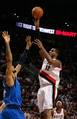 PORTLAND, OR - APRIL 23:  LaMarcus Aldrdige #12 of the Portland Trail Blazers shoots against Tyson Chandler #6 of the Dallas Mavericks in Game Four of the Western Conference Quarterfinals in the 2011 NBA Playoffs on April 23, 2011 at the Rose Garden in Po