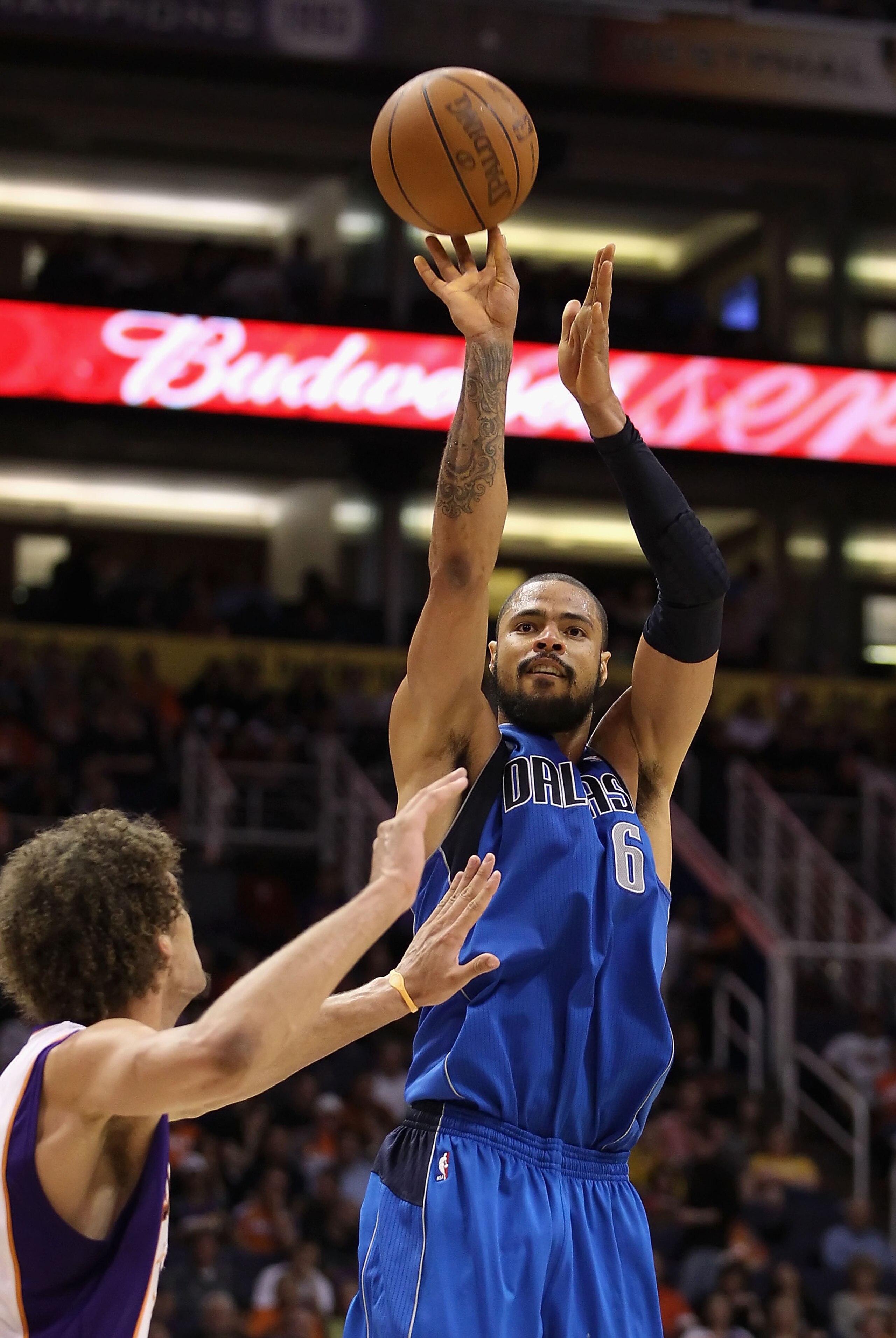 PHOENIX, AZ - FEBRUARY 17:  Tyson Chandler #6 of the Dallas Mavericks puts up a shot over Robin Lopez #15 of the Phoenix Suns during the NBA game at US Airways Center on February 17, 2011 in Phoenix, Arizona. The Mavericks defeated the Suns 112-106. NOTE 