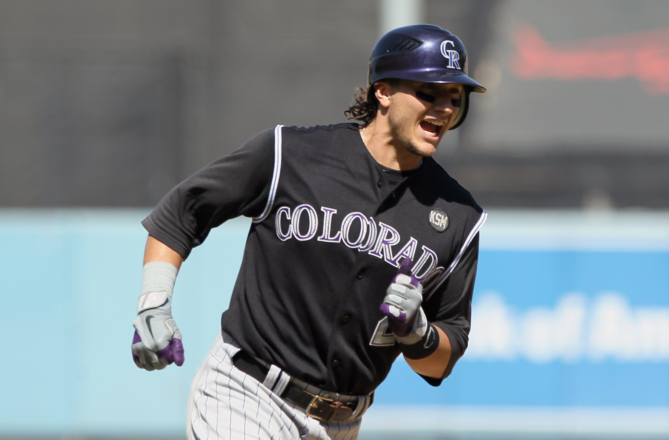 LOS ANGELES, CA - SEPTEMBER 18: Troy Tulowitzki #2 of the Colorado Rockies celebrates as he rounds third base after hitting his second two-run home run of the game against the Los Angeles Dodgers in the fifth inning at Dodger Stadium on September 18, 201 LOS ANGELES, CA - SEPTEMBER 18: Troy Tulowitzki #2 of the Colorado Rockies celebrates as he rounds third base after hitting his second two-run home run of the game against the Los Angeles Dodgers in the fifth inning at Dodger Stadium on September 18, 201