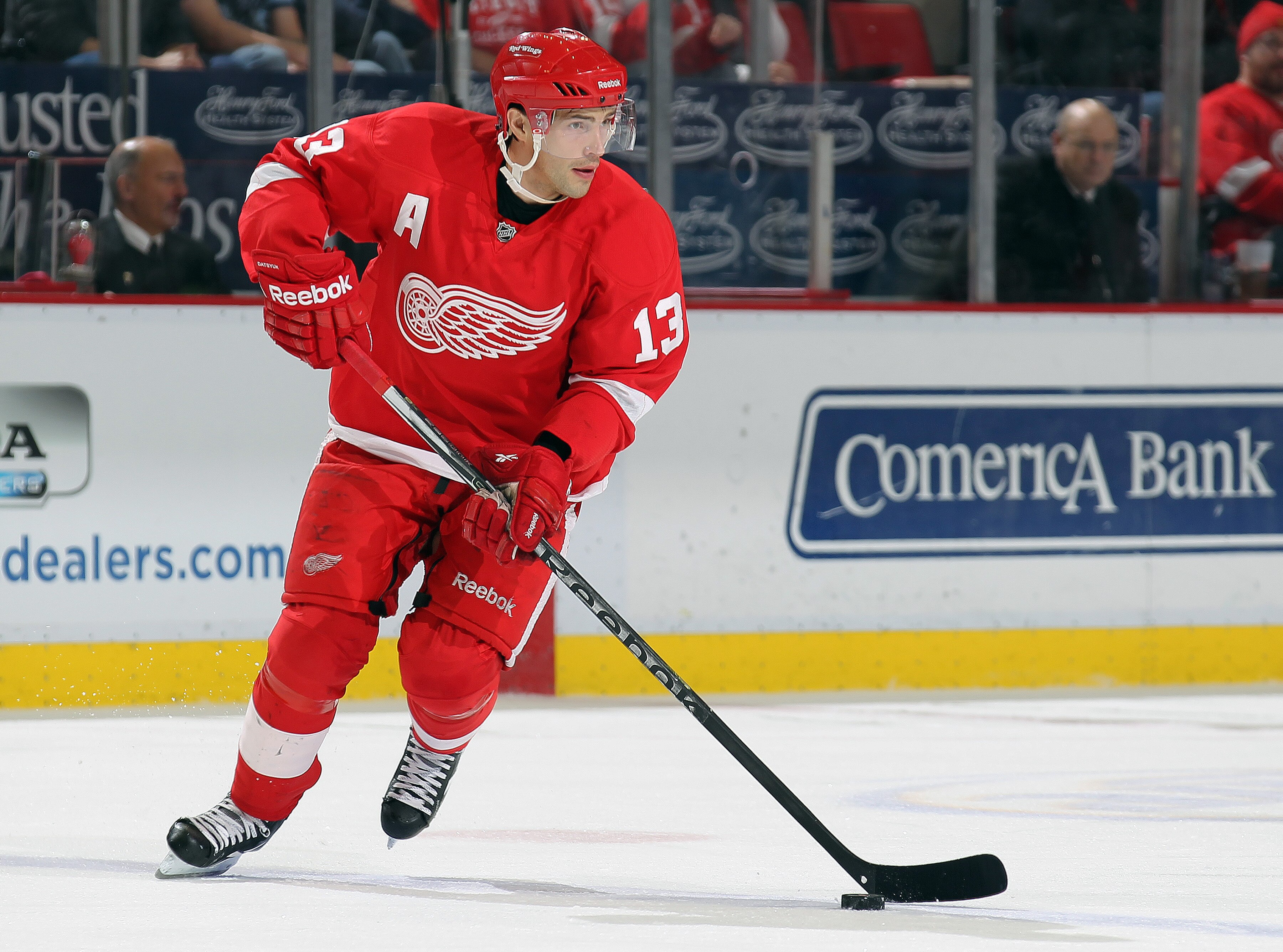 DETROIT,MI - DECEMBER 10:  Pavel Datsyuk #13 of the Detroit Red Wings skates with the puck during the game against the Montreal Canadiens at the Joe Louis Arena on December 10, 2010  in Detroit, Michigan. The Wings defeated the Canadiens 4-2. (Photo by Cl