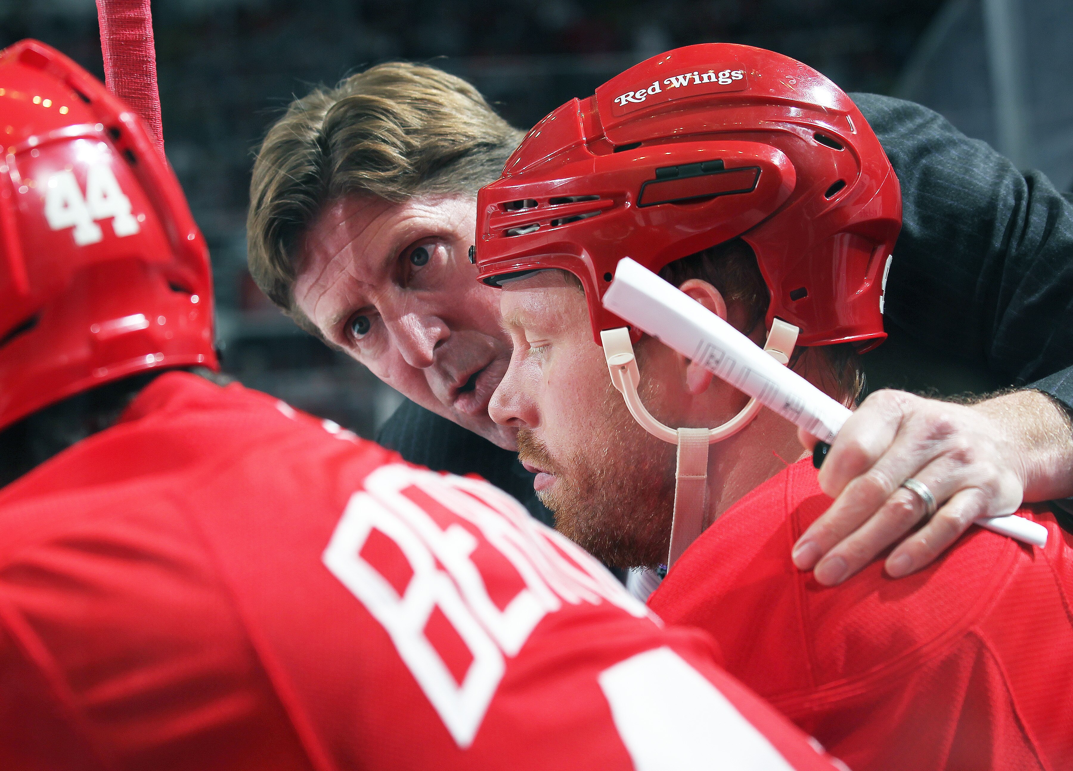 DETROIT,MI - DECEMBER 10:  Head coach Mike Babcock of the Detroit Red Wings gives instructions to Johan Franzen #93 and team during the game against the Montreal Canadiens at the Joe Louis Arena on December 10, 2010 in Detroit, Michigan. The Wings defeate