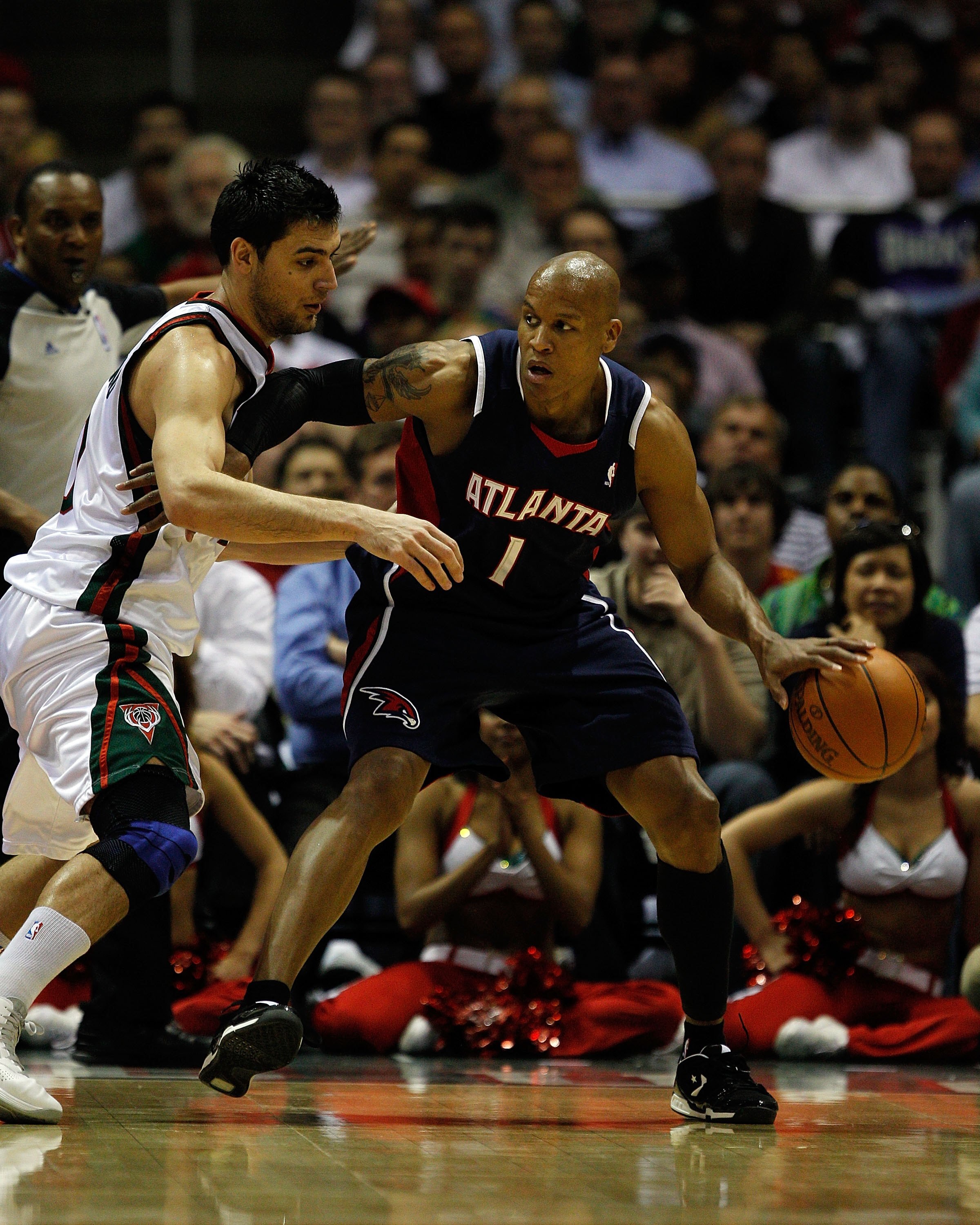 MILWAUKEE - APRIL 26: Maurice Evans #1 of the Atlanta Hawks moves against Carlos Delfino #10 of the Milwaukee Bucks in Game Four of the Eastern Conference Quarterfinals during the 2010 NBA Playoffs at the Bradley Center on April 26, 2010 in Milwaukee, Wis