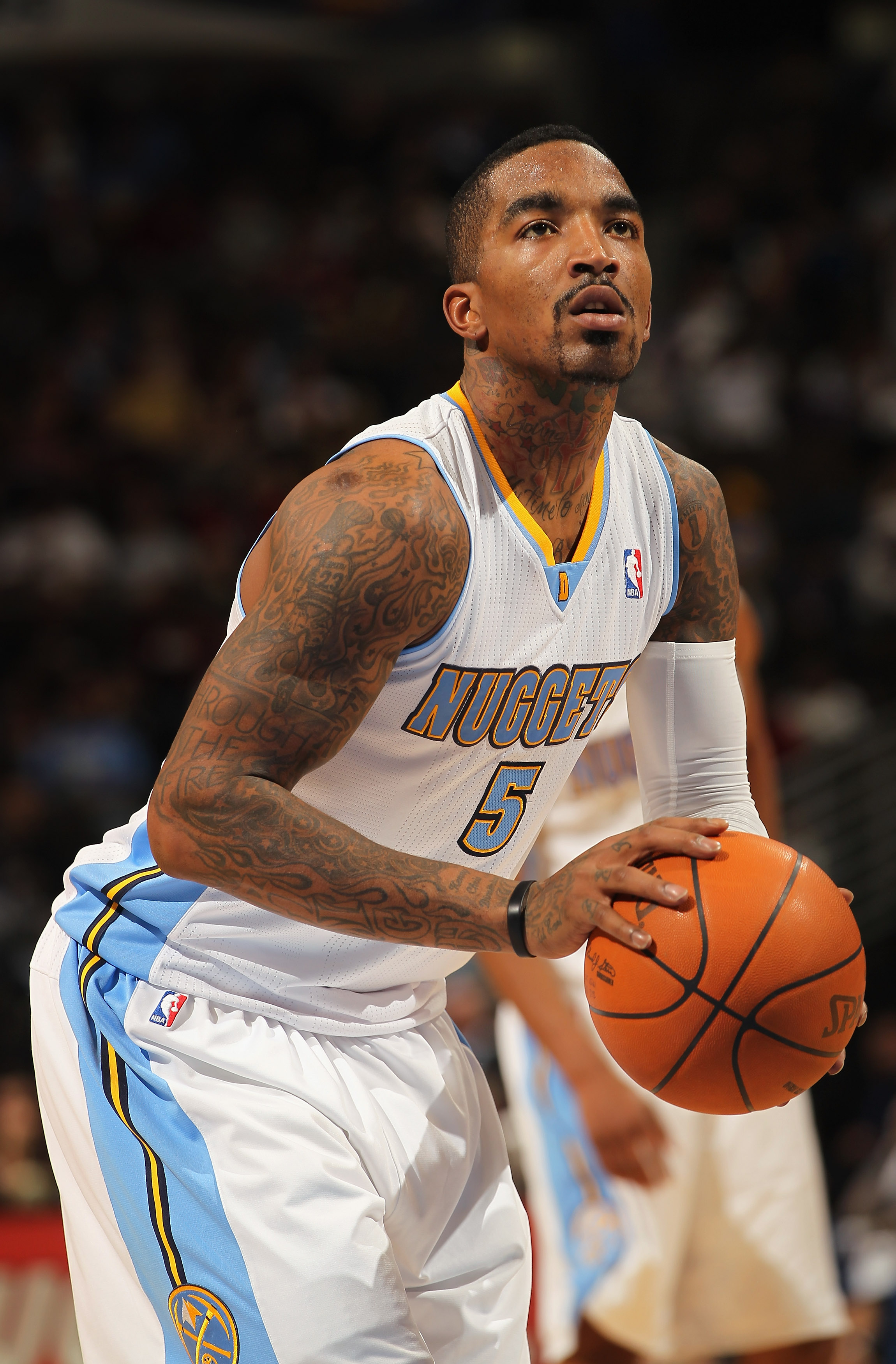 DENVER - DECEMBER 28:  J.R. Smith #5 of the Denver Nuggets takes a free throw against the Portland Trail Blazers at Pepsi Center on December 28, 2010 in Denver, Colorado. The Nuggets defeated the Blazers 95-77. NOTE TO USER: User expressly acknowledges an