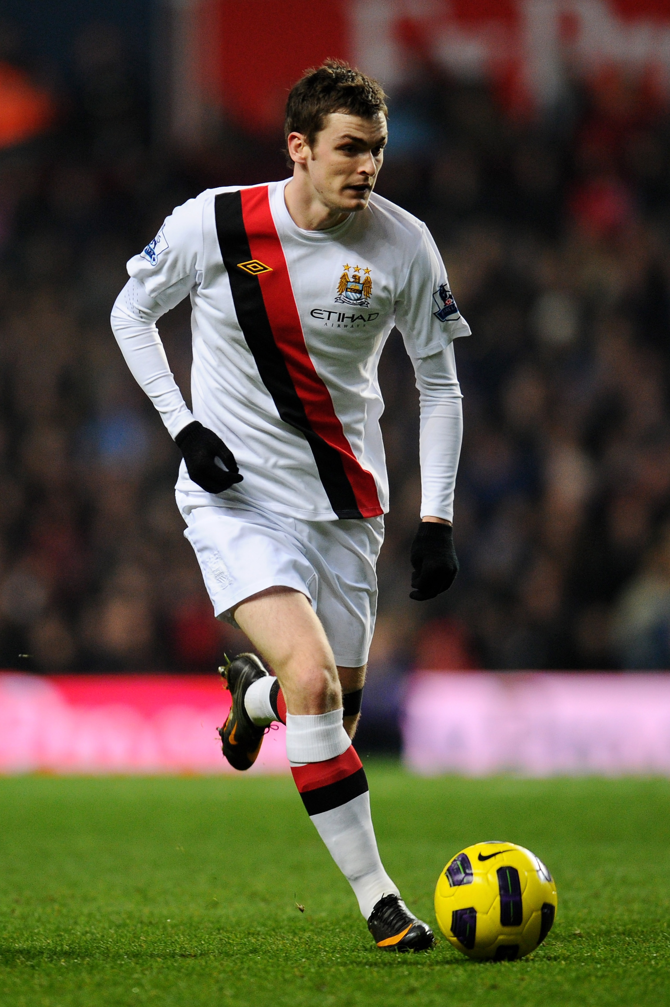BIRMINGHAM, ENGLAND - JANUARY 22:  Adam Johnson of Manchester City runs with the ball during the Barclays Premier League match between Aston Villa and Manchester City at Villa Park on January 22, 2011 in Birmingham, England.  (Photo by Clive Mason/Getty I
