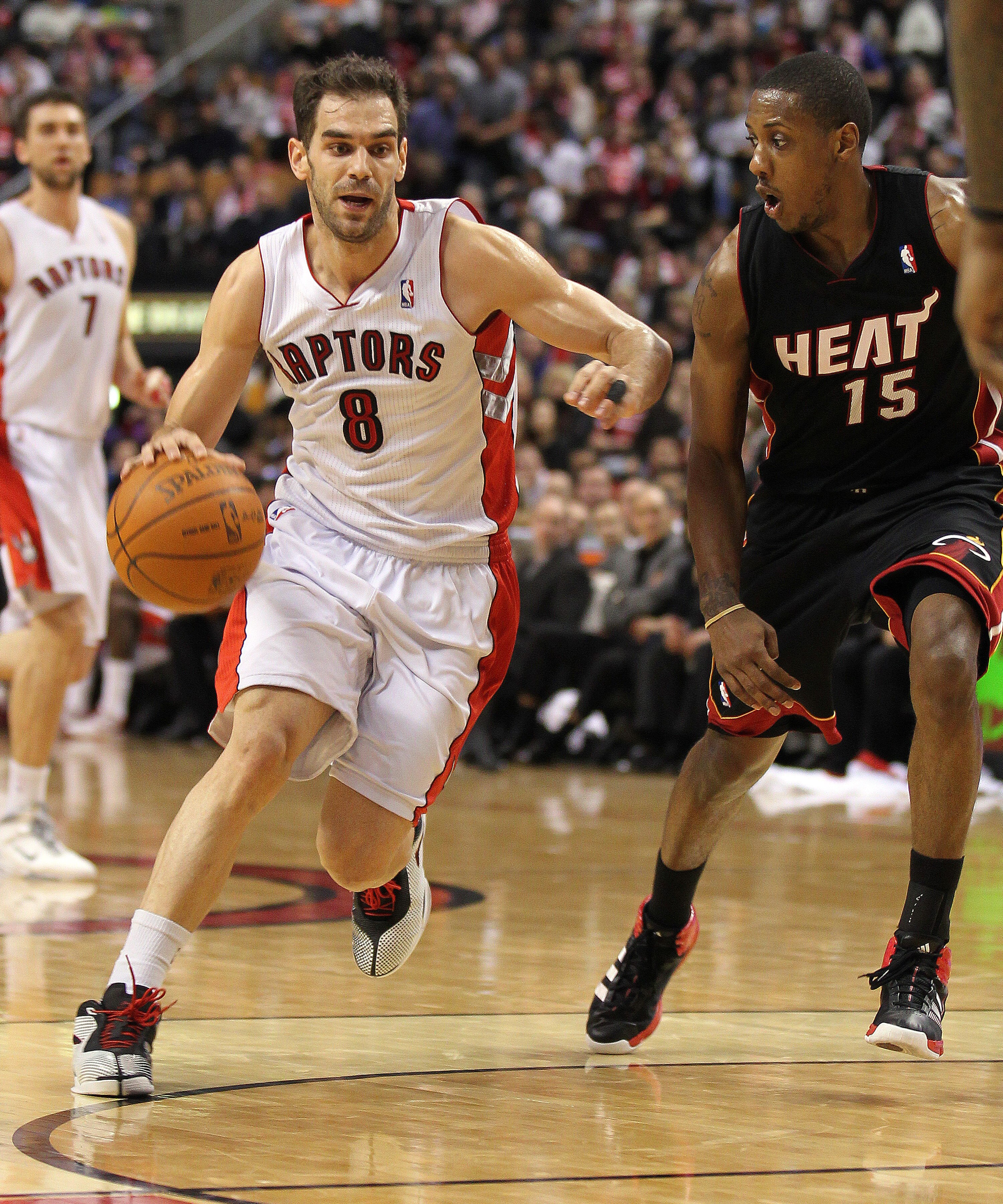 TORONTO, CANADA - FEBRUARY 16:  Jose Calderon #8 of the Toronto Raptors tries to drive around Mario Chalmers #15 of the Miami Heat in a game on February 16, 2011 at the Air Canada Centre in Toronto, Canada. The Heat defeated the Raptors 103-95. (Photo by