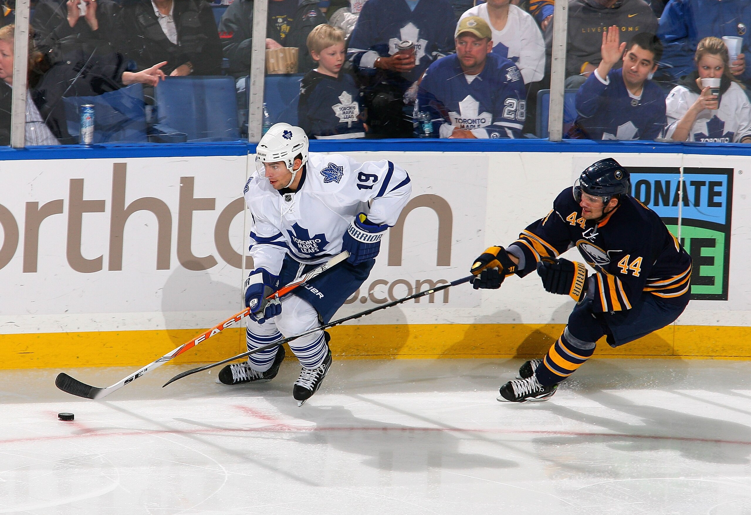 BUFFALO, NY - FEBRUARY 16: Joffrey Lupul #19  of the Toronto Maple Leafs controls the puck ahead of Andrej Sekera #44 of the Buffalo Sabres  at HSBC Arena on February 16, 2011 in Buffalo, New York.  (Photo by Rick Stewart/Getty Images)