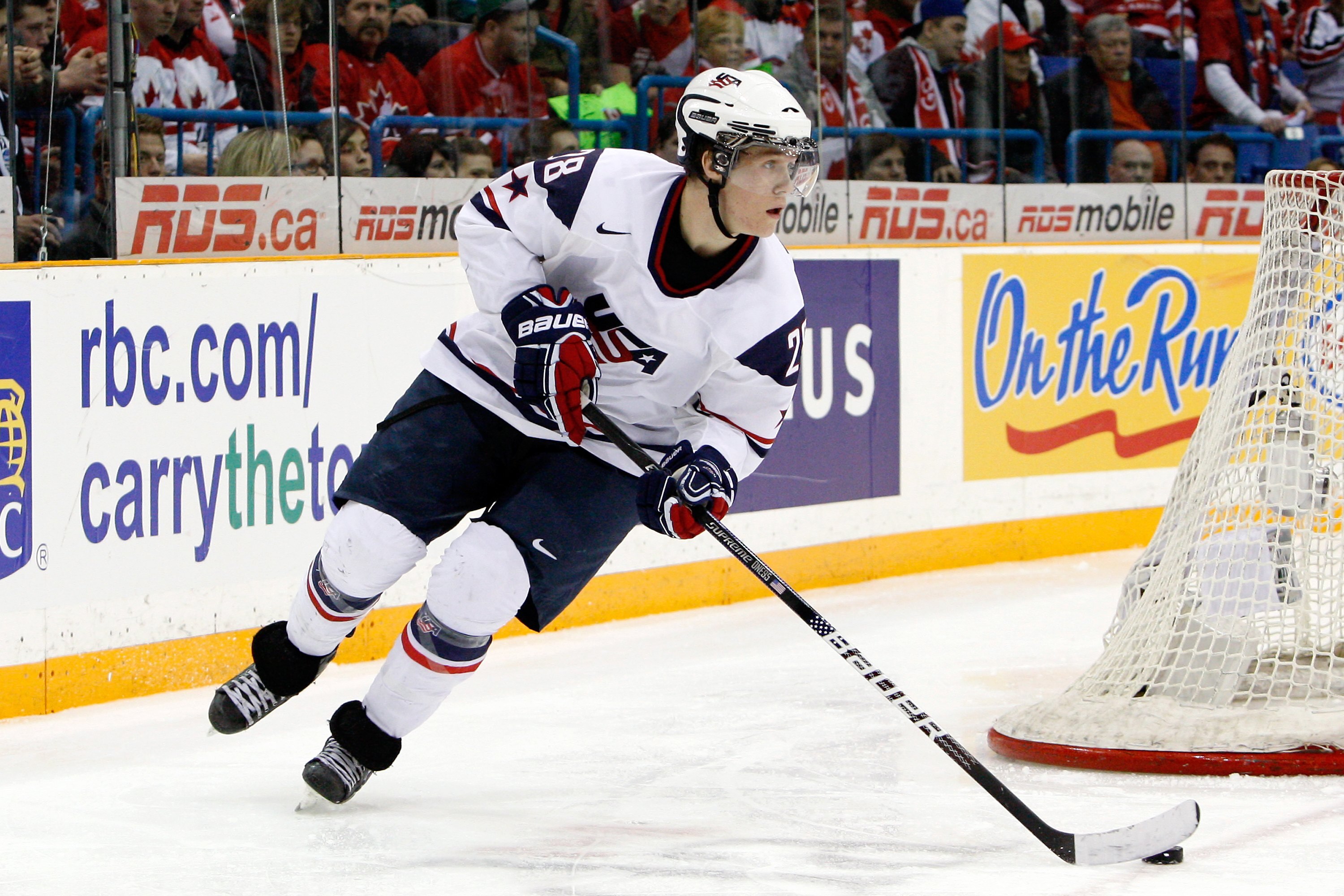 SASKATOON, SK - JANUARY 5:  Jake Gardiner #28 of Team USA skates with the puck during the 2010 IIHF World Junior Championship Tournament Gold Medal game against Team Canada on January 5, 2010 at the Credit Union Centre in Saskatoon, Saskatchewan, Canada.