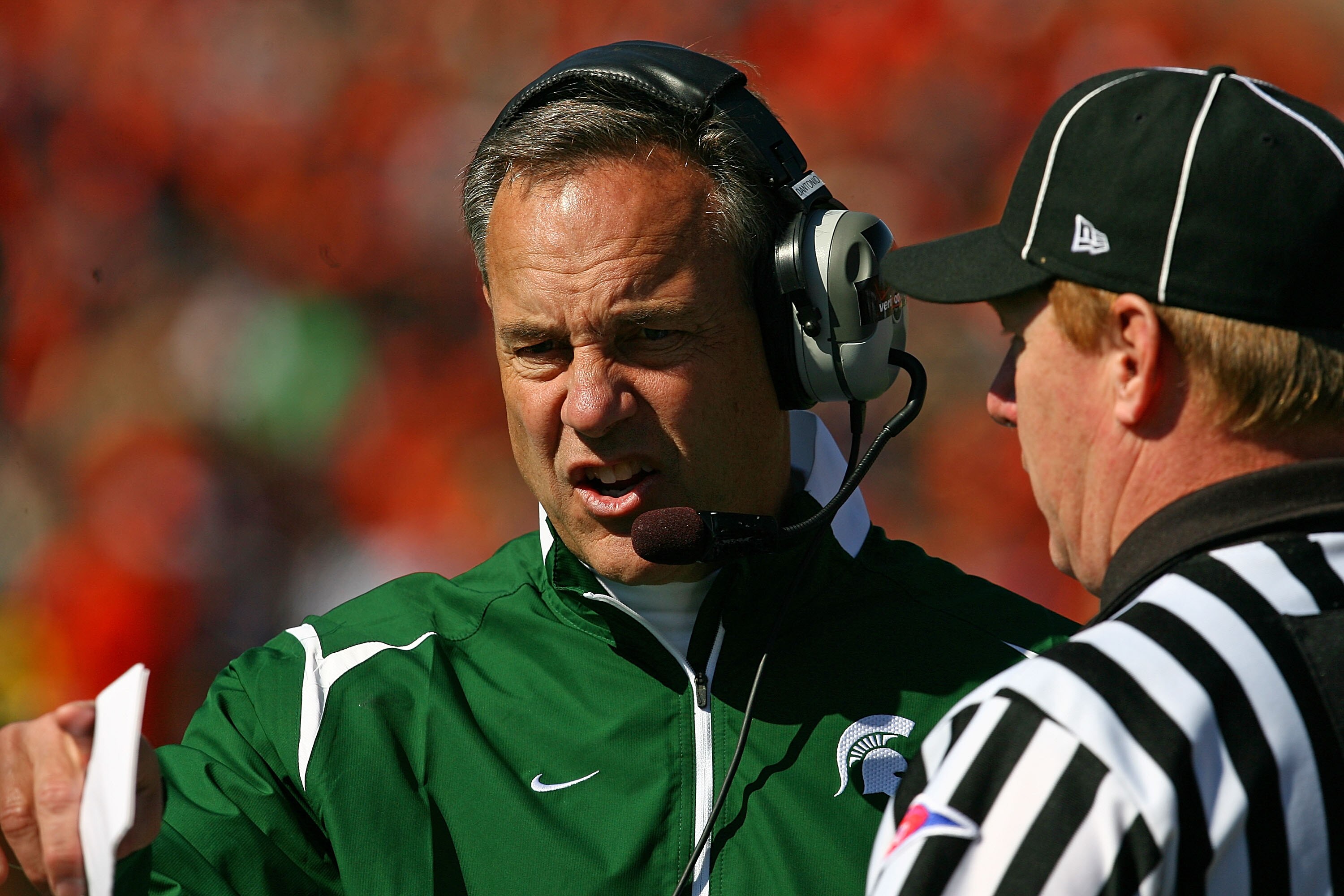 CHAMPAIGN, IL - OCTOBER 10: Head coach Mark Dantonio of the Michigan State Spartans argues with a referee during a game against the Illinois Fighting Illini on October 10, 2009 at Memorial Stadium at the University of Illinois in Champaign, Illinois. Mich