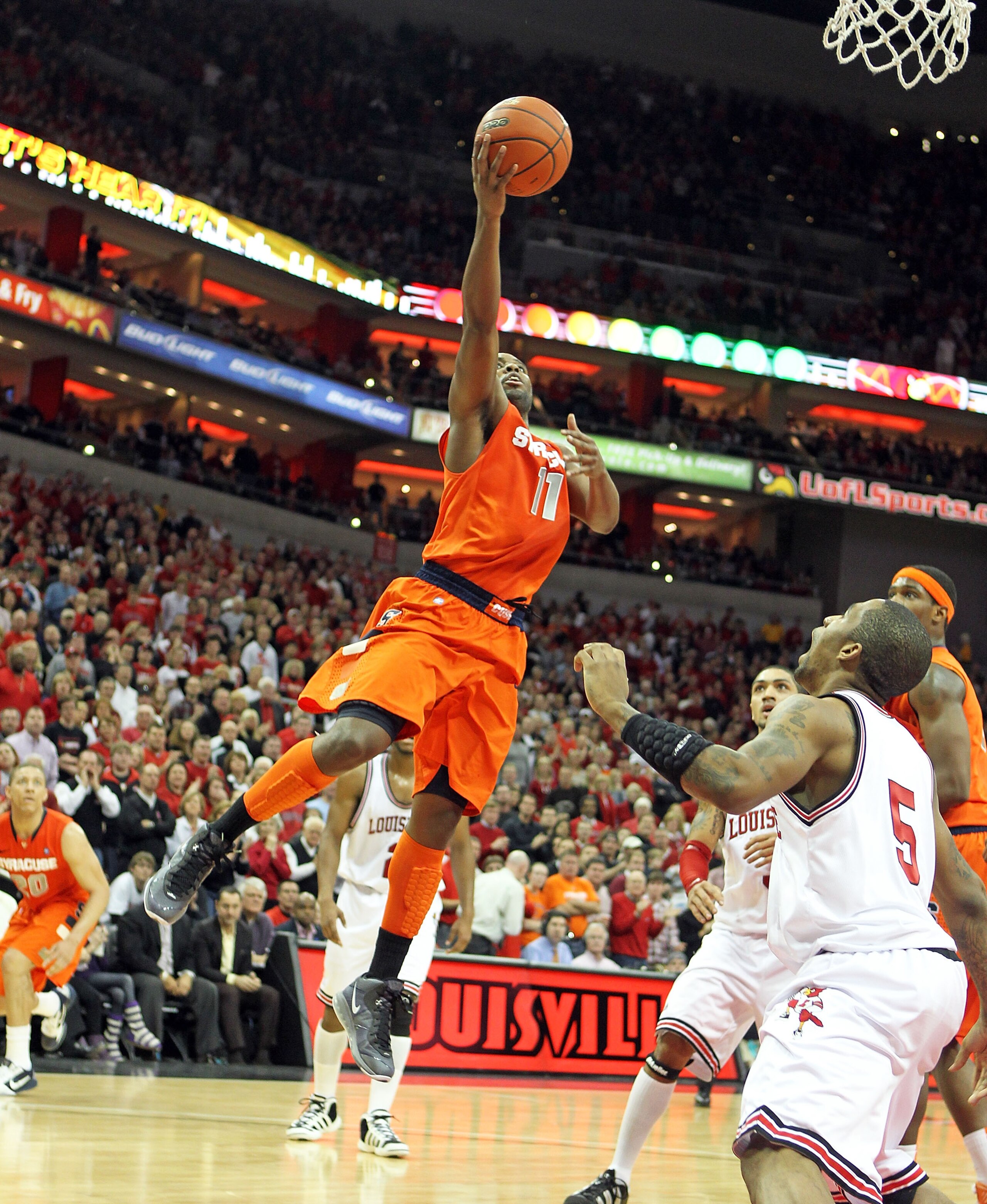 LOUISVILLE, KY - FEBRUARY 12:  Scoop Jardine #11 of the Syracuse Orange shoots the ball during the Big East Conference game against the Louisville Cardinals at the KFC Yum! Center on February 12, 2011 in Louisville, Kentucky.  Louisville won 73-69.  (Phot