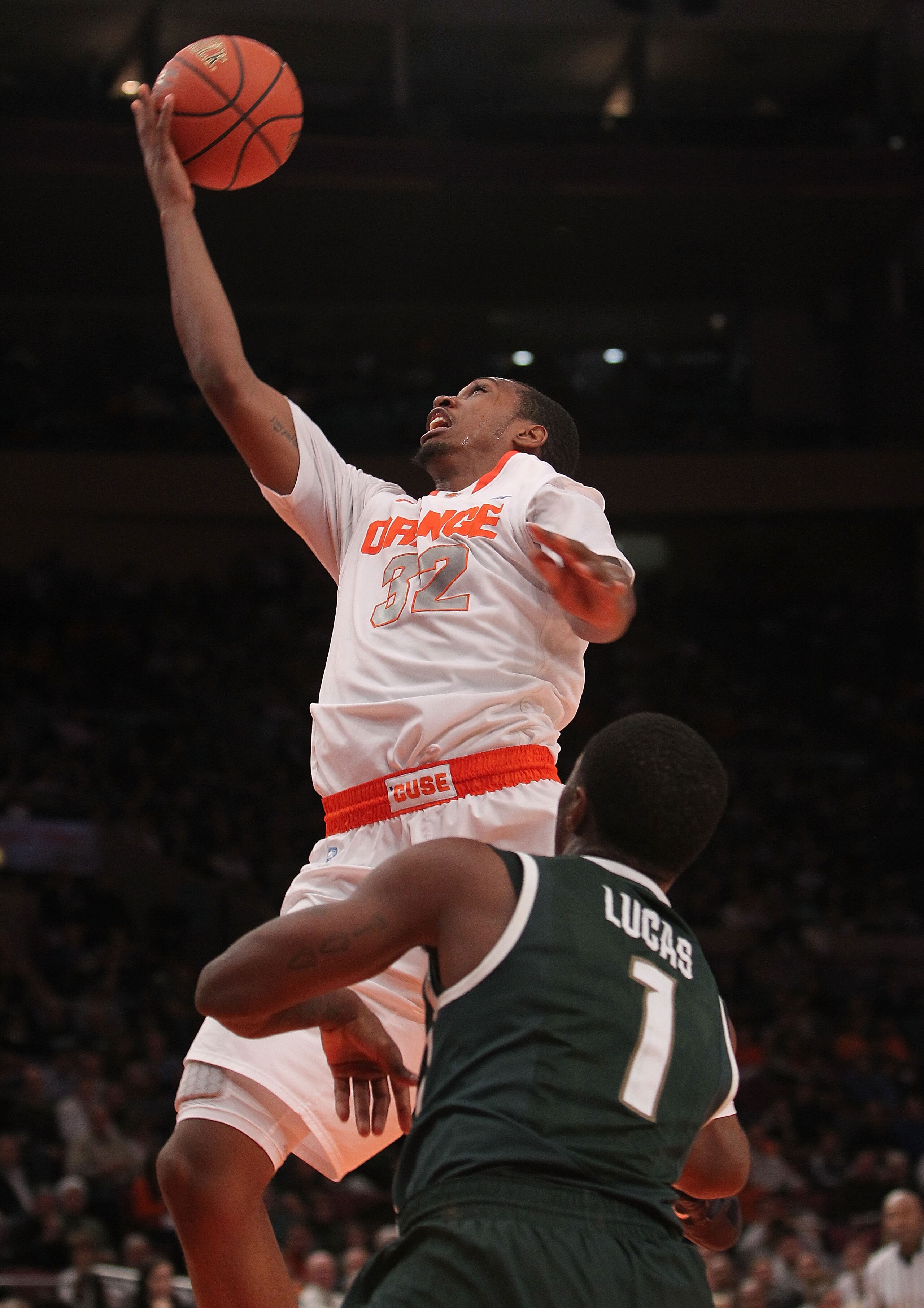NEW YORK, NY - DECEMBER 07: Kris Joseph #32 of Syracuse Orange lays the ball up against the Michigan State Spartans during their game at the Jimmy V Classic at Madison Square Garden on December 7, 2010 in New York City.  (Photo by Nick Laham/Getty Images)