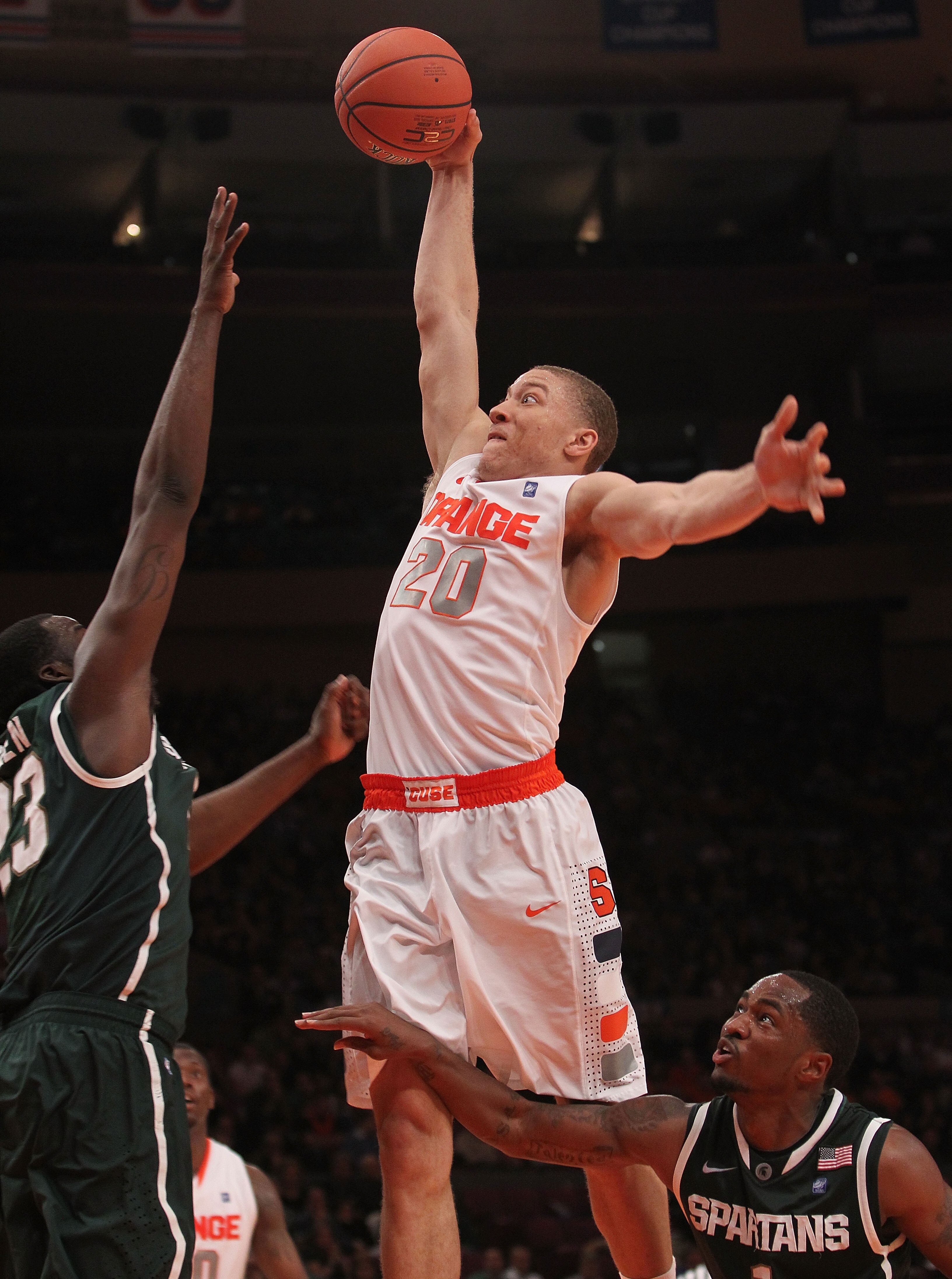 NEW YORK, NY - DECEMBER 07:  Brandon Triche #30 of Syracuse Orange goes up for the dunk against the Michigan State Spartans during their game at the Jimmy V Classic at Madison Square Garden on December 7, 2010 in New York City.  (Photo by Nick Laham/Getty