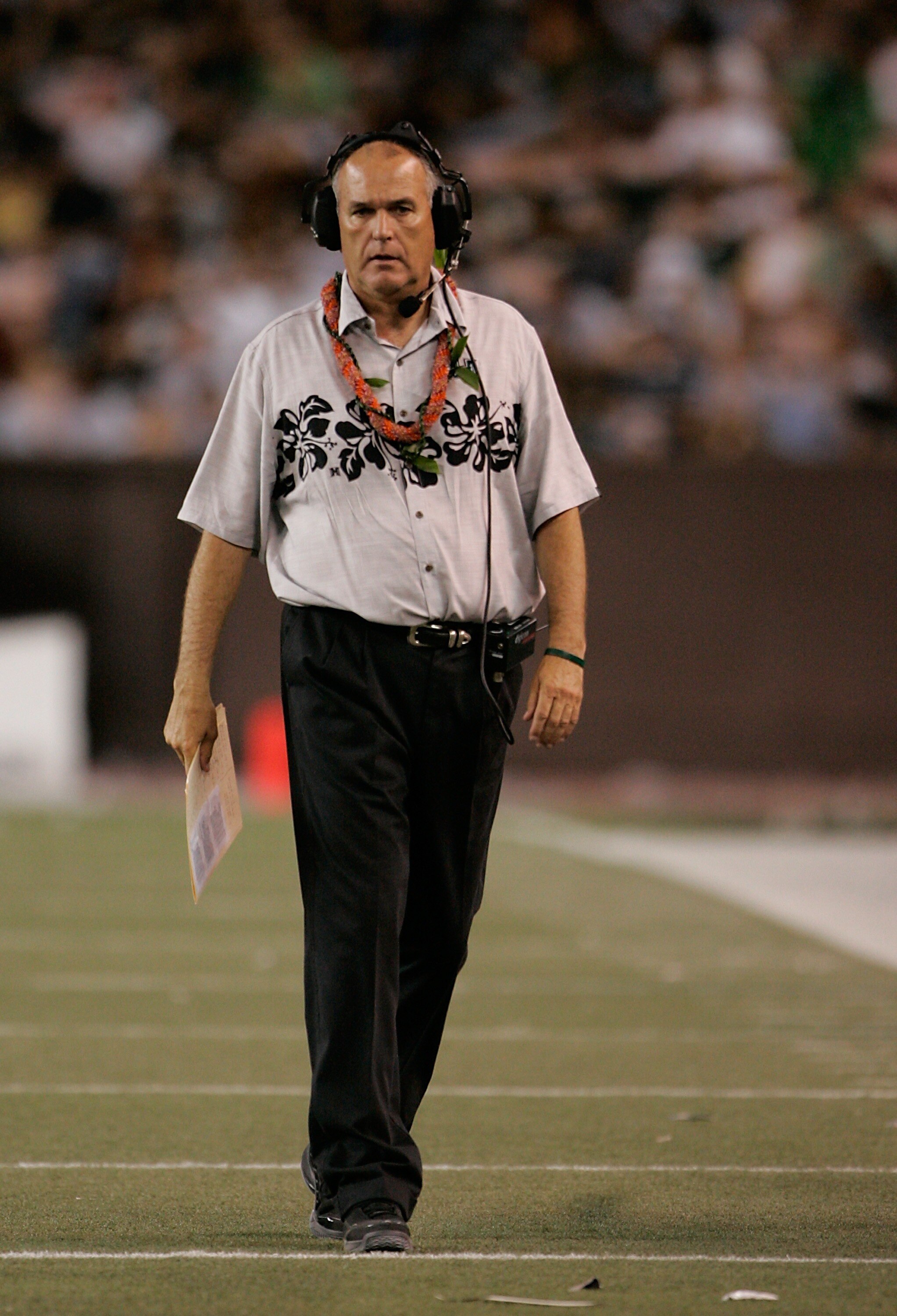 HONOLULU - SEPTEMBER 22:  University of Hawaii Warriors head coach June Jones walks the sidelines during their game against Charleston Southern Buccaneers at Aloha Stadium, September 22, 2007 in Honolulu, Hawaii.  (Photo by Marco Garcia/Getty Images)