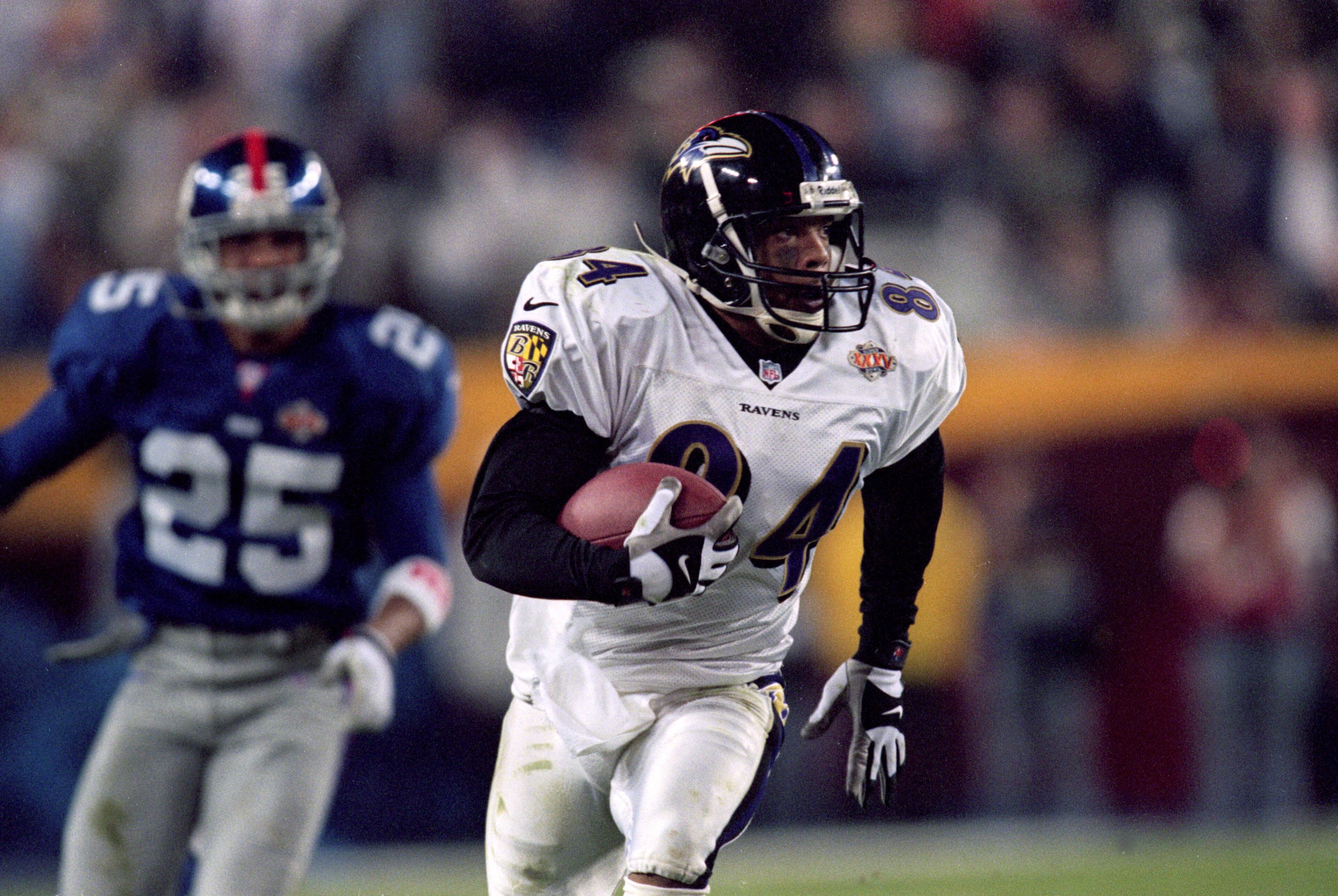 28 Jan 2001: Jermaine Lewis #84 of the Baltimore Ravens runs with the ball for an 84 yard touchdown return during the Super Bowl XXXV Game against the New York Giants at the Raymond James Stadium in Tampa, Florida. The Ravens defeated the Giants 34-7. Ma 28 Jan 2001: Jermaine Lewis #84 of the Baltimore Ravens runs with the ball for an 84 yard touchdown return during the Super Bowl XXXV Game against the New York Giants at the Raymond James Stadium in Tampa, Florida. The Ravens defeated the Giants 34-7. Ma