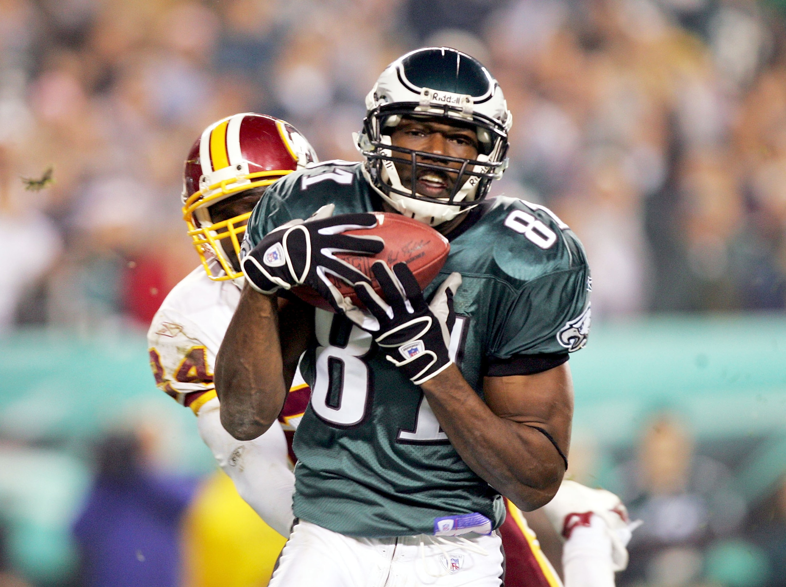 PHILADELPHIA - NOVEMBER 21: Terrell Owens #81 of the Philadelphia Eagles catches the ball in front of Shawn Springs #24 of the Washington Redskins to score a touchdown in the third quarter at Lincoln Financial Field on November 21, 2004 in Philadelphia, PHILADELPHIA - NOVEMBER 21: Terrell Owens #81 of the Philadelphia Eagles catches the ball in front of Shawn Springs #24 of the Washington Redskins to score a touchdown in the third quarter at Lincoln Financial Field on November 21, 2004 in Philadelphia,
