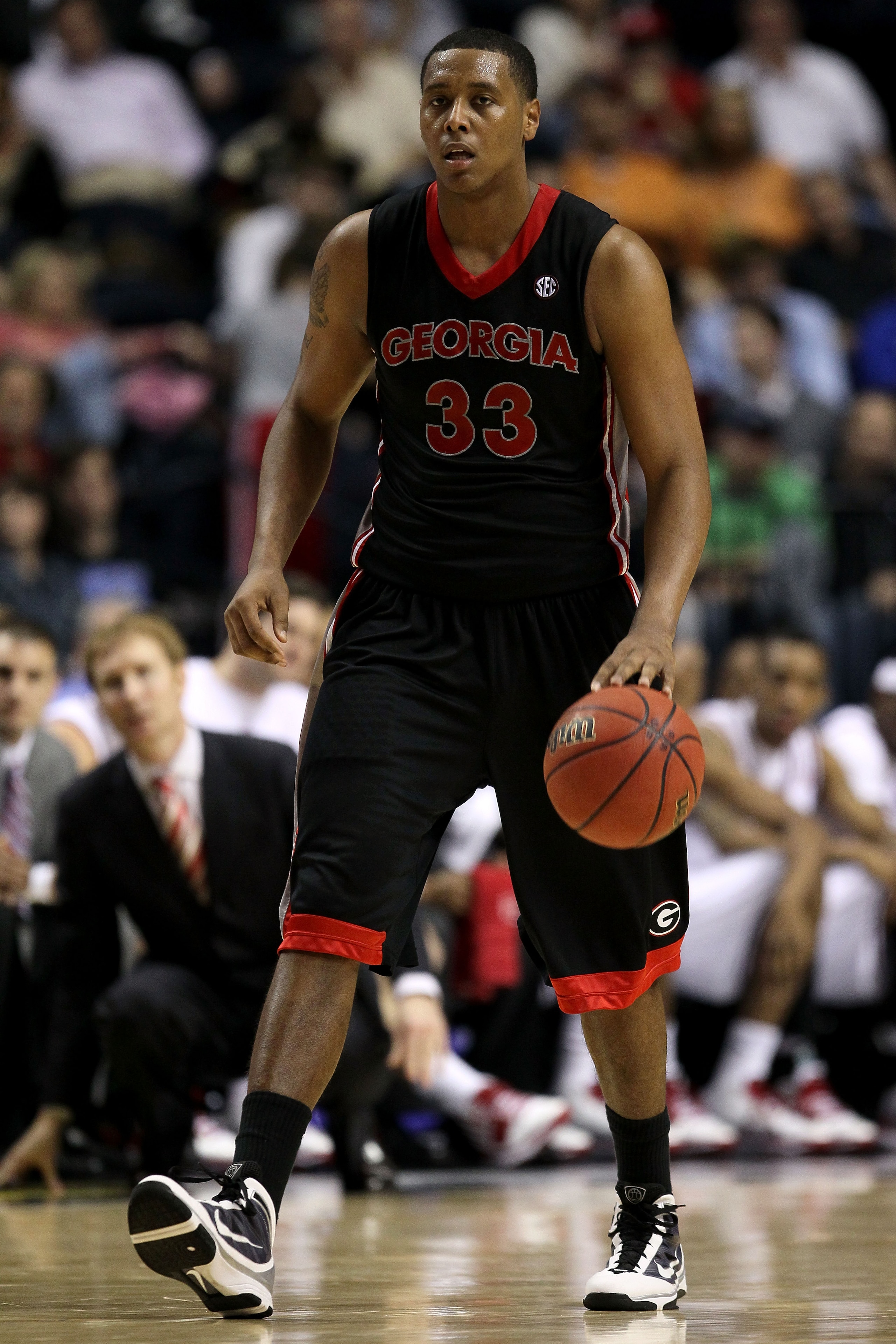 NASHVILLE, TN - MARCH 11: Trey Thompkins #33 of the Georgia Bulldogs brings the ball up against the Arkanasas Razorbacks during the first round of the SEC Men's Basketball Tournament at the Bridgestone Arena on March 11, 2010 in Nashville, Tennessee. (P NASHVILLE, TN - MARCH 11: Trey Thompkins #33 of the Georgia Bulldogs brings the ball up against the Arkanasas Razorbacks during the first round of the SEC Men's Basketball Tournament at the Bridgestone Arena on March 11, 2010 in Nashville, Tennessee. (P