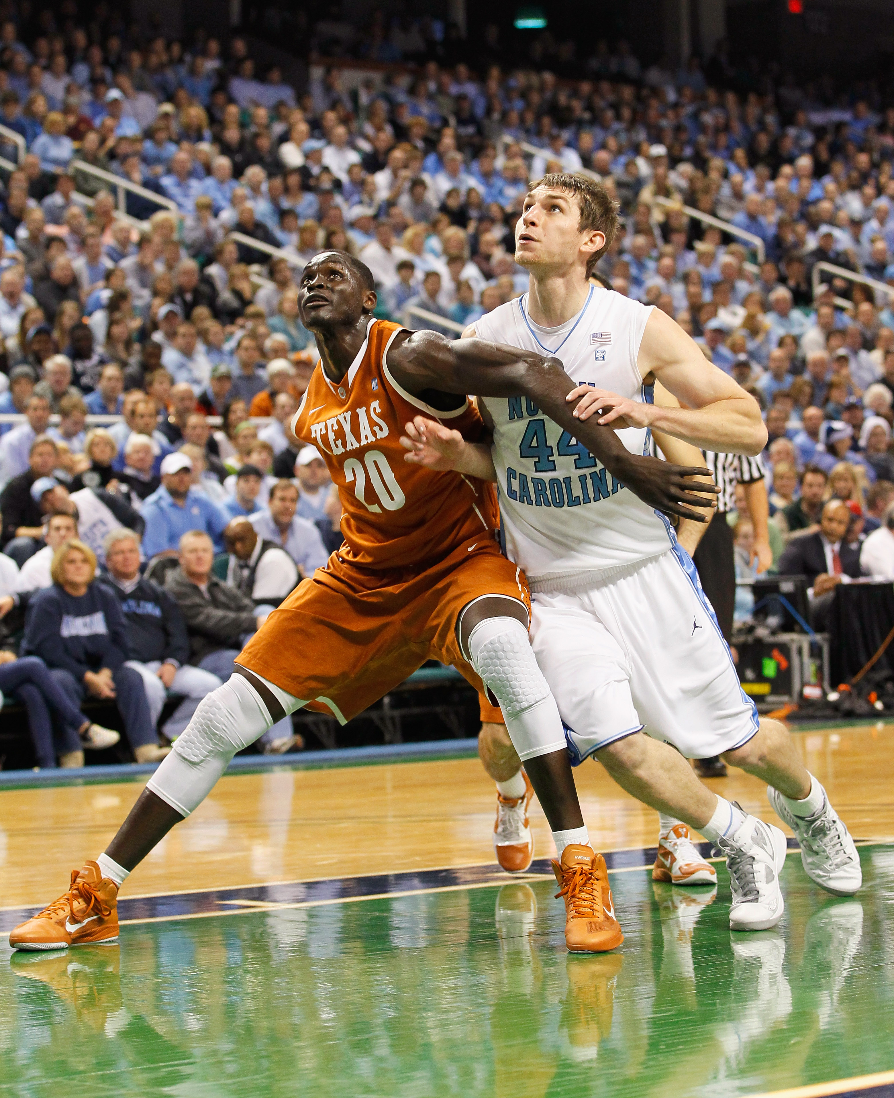 GREENSBORO, NC - DECEMBER 18:  Tyler Zeller #44 of the North Carolina Tar Heels battles for a rebound against Alexis Wangmene #20 of the Texas Longhorns at Greensboro Coliseum on December 18, 2010 in Greensboro, North Carolina.  (Photo by Kevin C. Cox/Get
