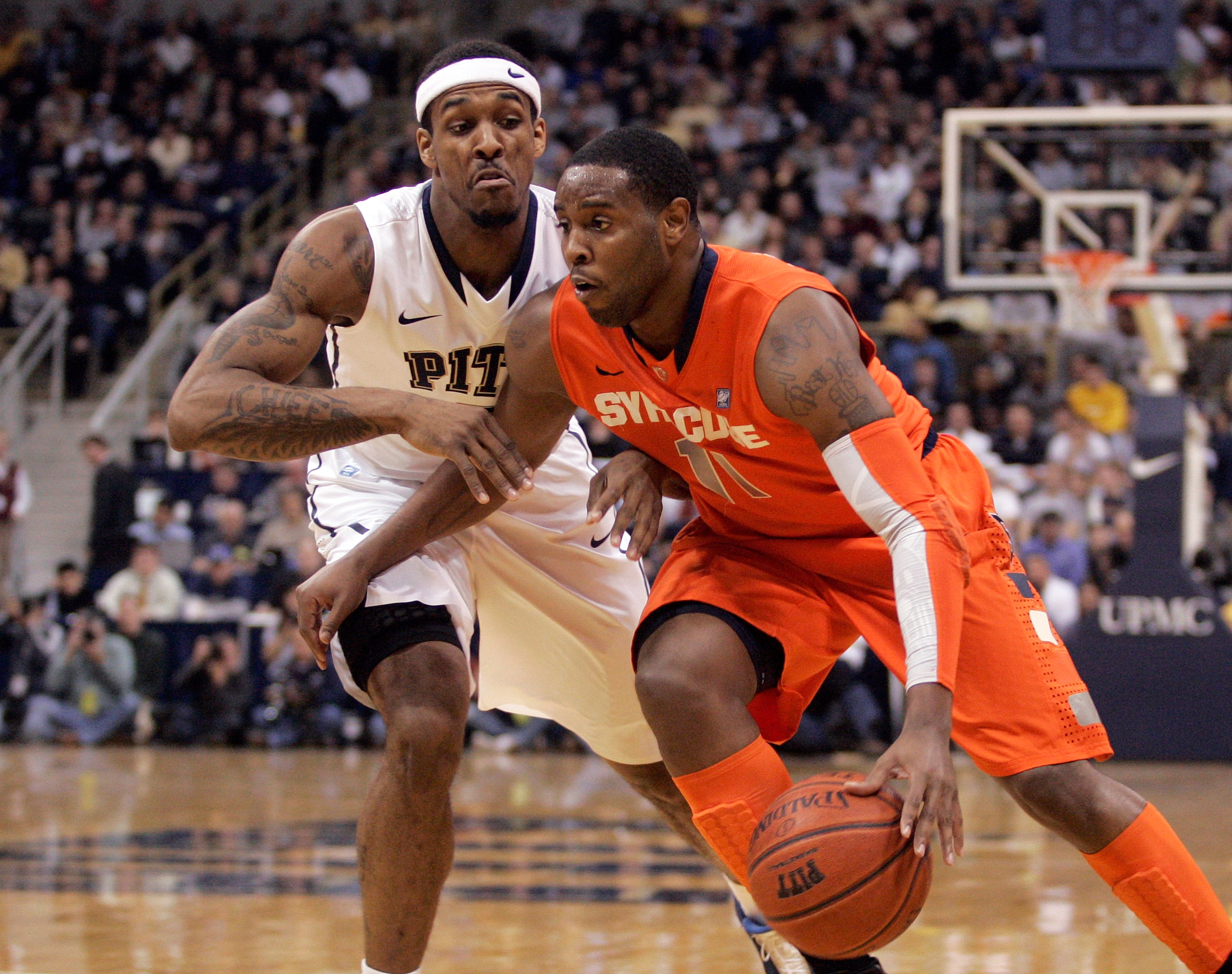 PITTSBURGH, PA - JANUARY 17: Scoop Jardine #11 of the Syracuse Orange drives to the basket as Gilbert Brown #5 of the Pittsburgh Panthers defends at Petersen Events Center on January 17, 2011 in Pittsburgh, Pennsylvania. (Photo by Justin K. Aller/Getty PITTSBURGH, PA - JANUARY 17: Scoop Jardine #11 of the Syracuse Orange drives to the basket as Gilbert Brown #5 of the Pittsburgh Panthers defends at Petersen Events Center on January 17, 2011 in Pittsburgh, Pennsylvania. (Photo by Justin K. Aller/Getty