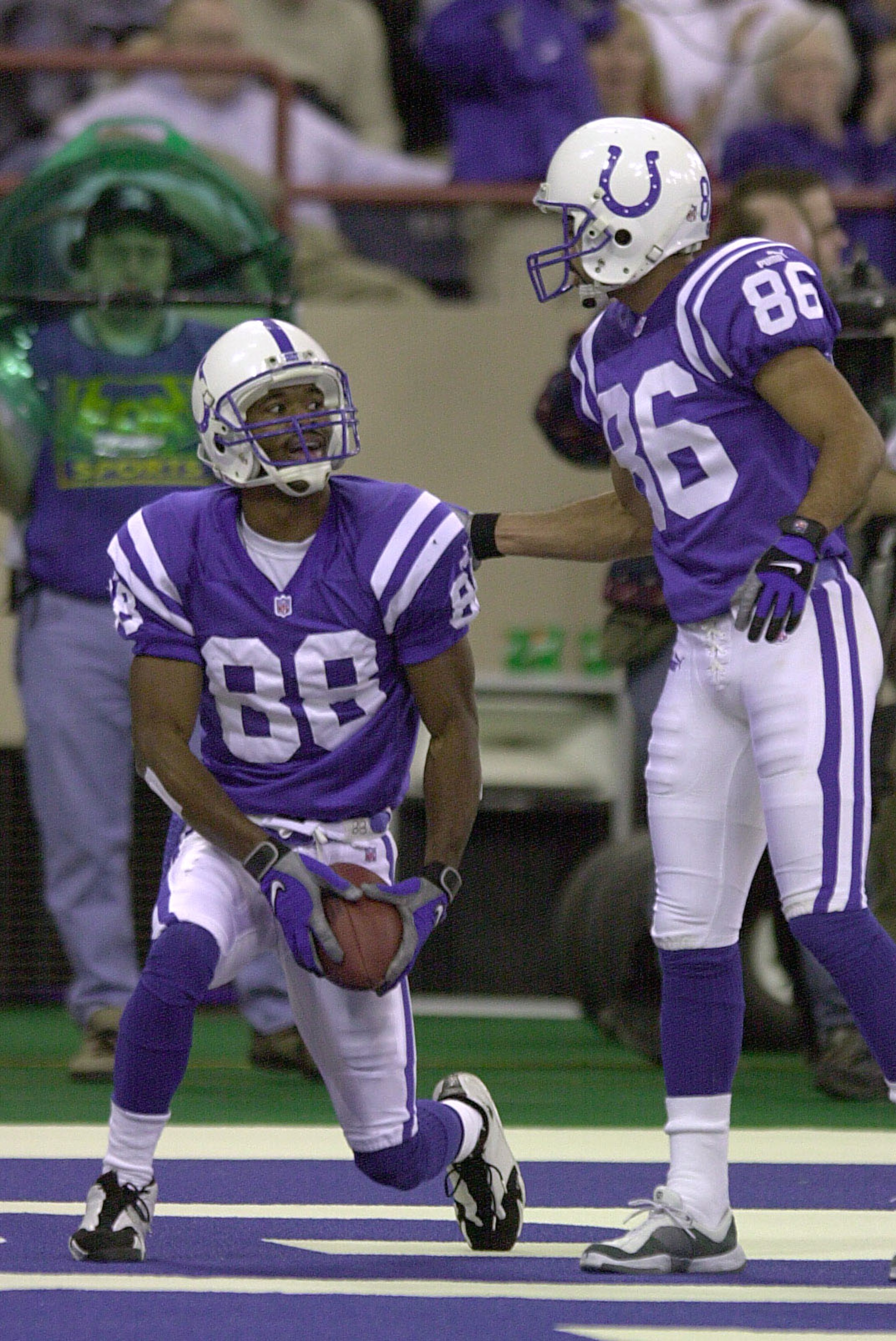 24 Dec 2000: Marvin Harrison #88 of the Indianapolis Colts is congratulated by teammate Jerome Pathon #86 after Harrison scored a touchdown against the Minnesota Vikings during the first half at the RCA Dome in Indianapolis, Indiana. DIGITAL IMAGE. Mandat