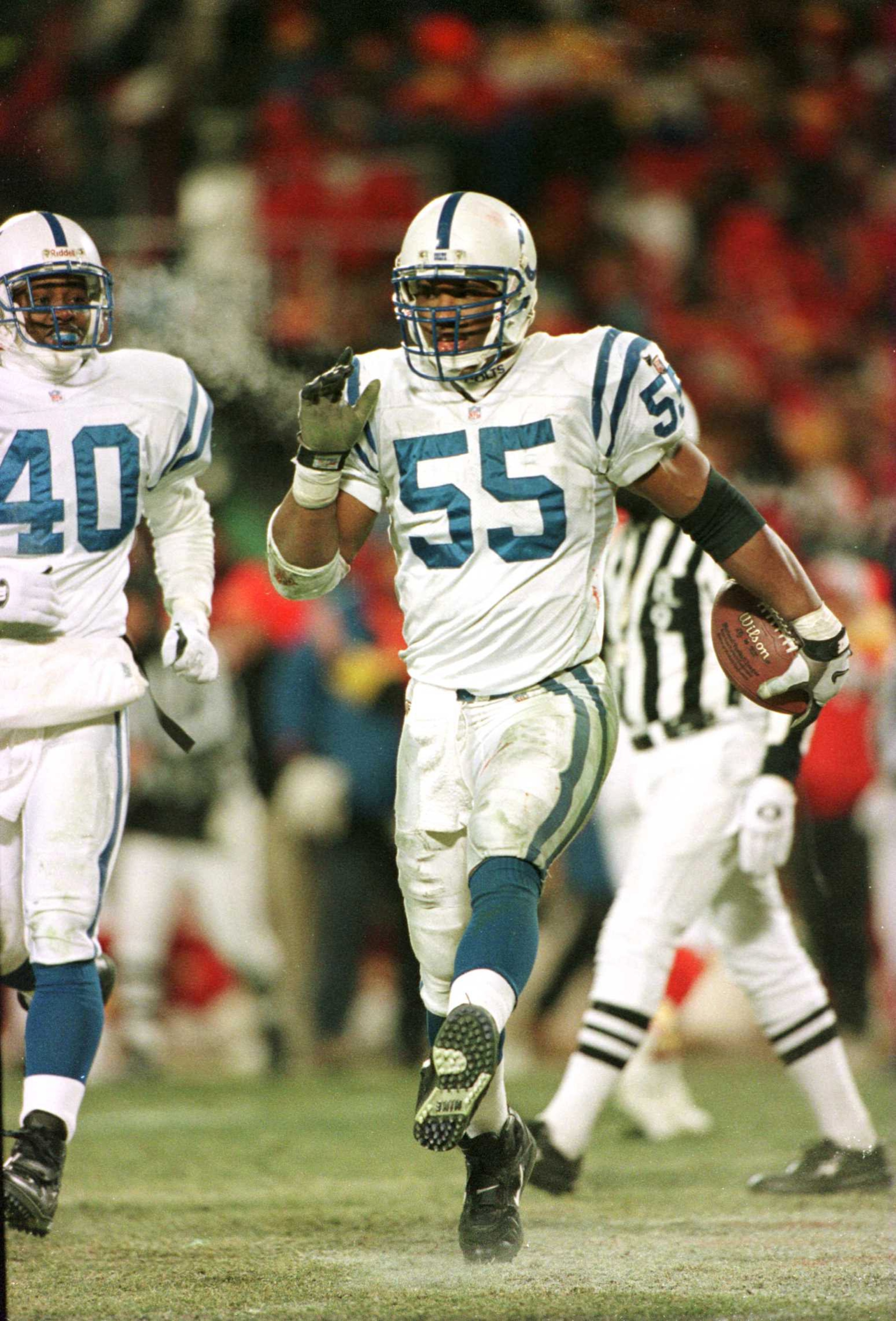 7 JAN 1996: LINEBACKER QUENTIN CORYATT #55 OF THE INDIANAPOLIS COLTS CELEBRATES AFTER INTERCEPTING A STEVE BONO PASS AGAINST THE KANSAS CITY CHIEFS IN THE FOURTH QUARTER OF THEIR AFC PLAYOFF GAME AT ARROWHEAD STADIUM IN KANSAS CITY, MISSOURI. Mandatory Cr