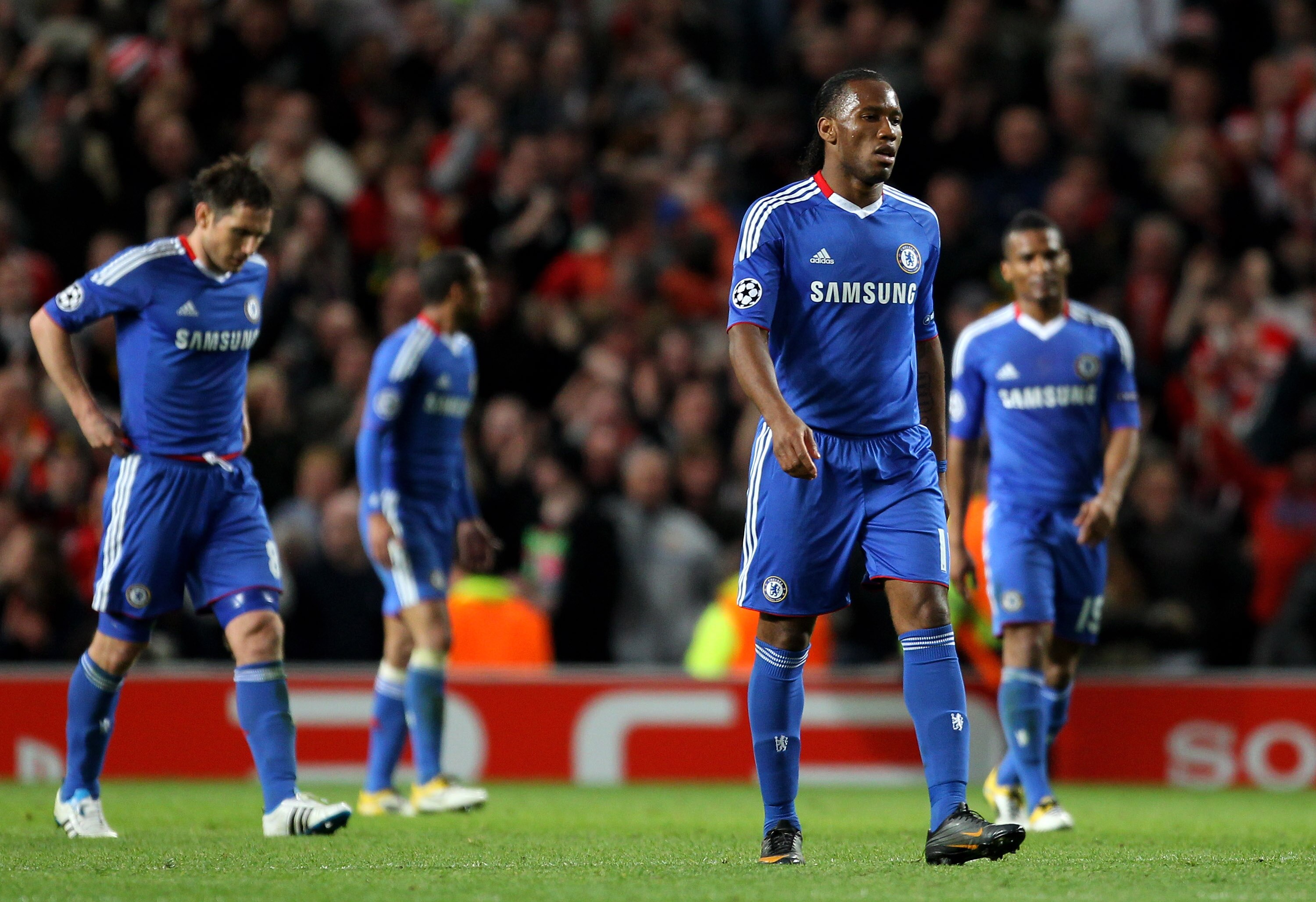 MANCHESTER, ENGLAND - APRIL 12:  Didier Drogba of Chelsea and his team mates look dejected during the UEFA Champions League Quarter Final second leg match between Manchester United and Chelsea at Old Trafford on April 12, 2011 in Manchester, England.  (Ph