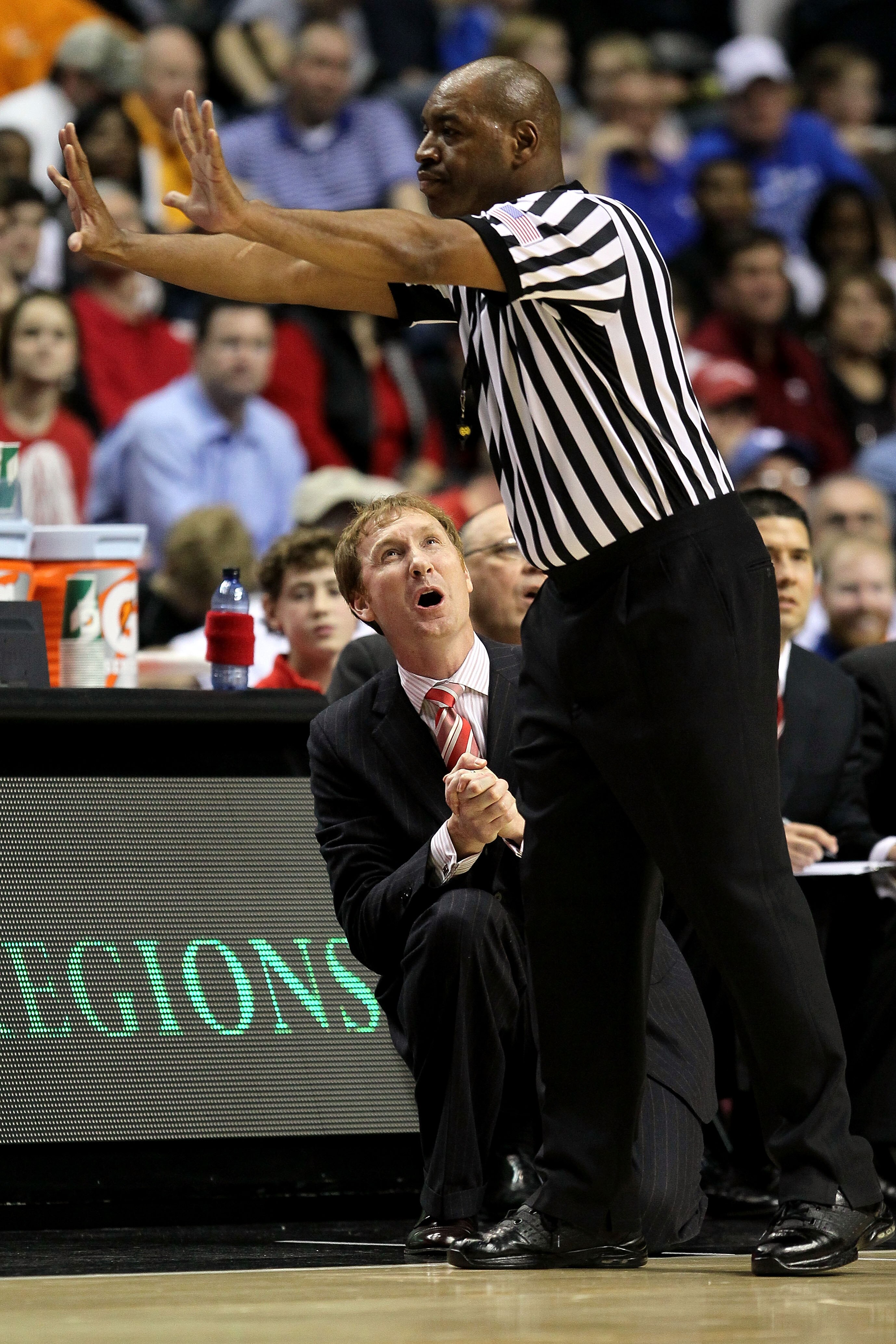 NASHVILLE, TN - MARCH 11:  Head coach John Pelphrey of the Arkanasas Razorbacks reacts to a call by the referee against the Georgia Bulldogs during the first round of the SEC Men's Basketball Tournament at the Bridgestone Arena on March 11, 2010 in Nashvi
