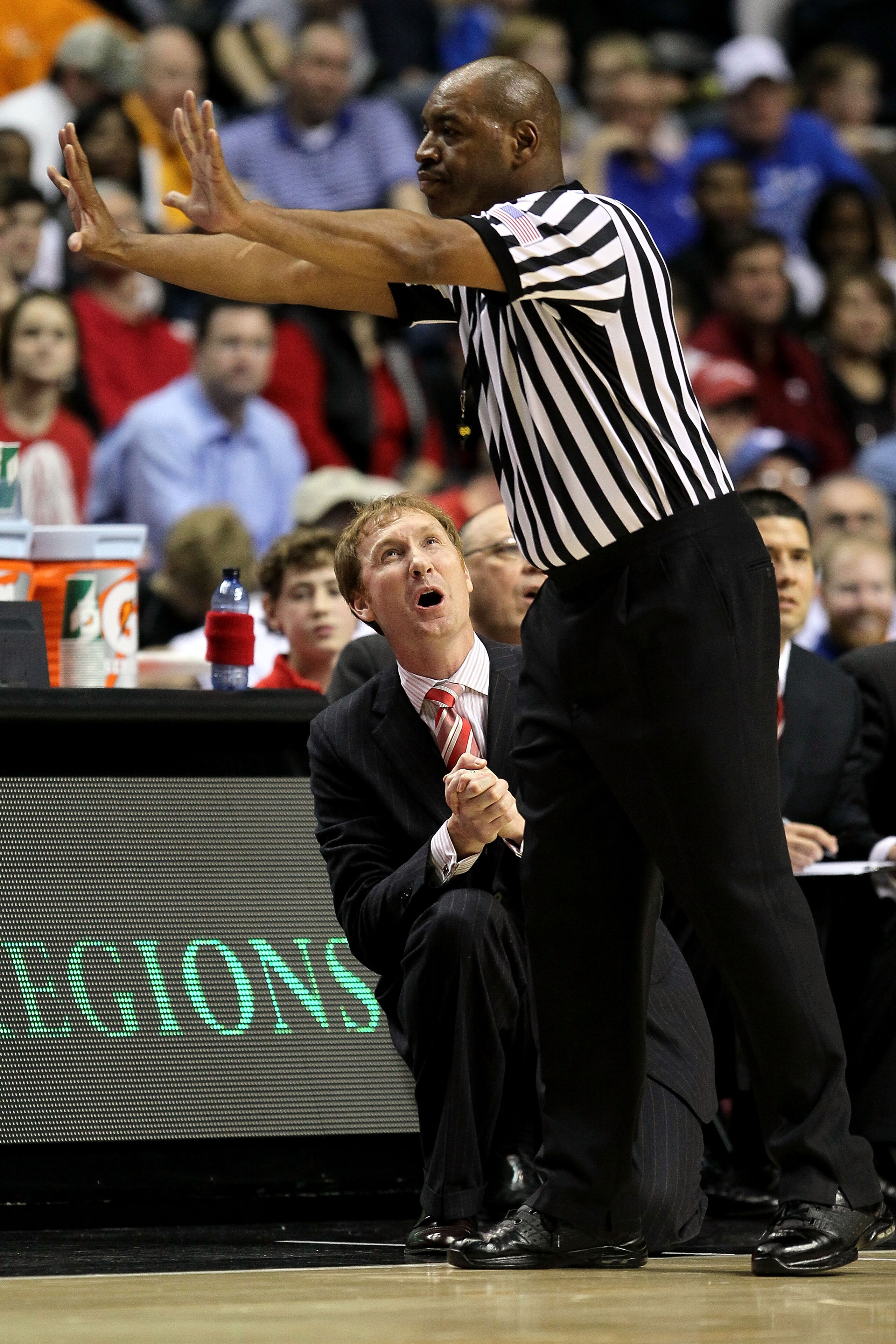 NASHVILLE, TN - MARCH 11:  Head coach John Pelphrey of the Arkanasas Razorbacks reacts to a call by the referee against the Georgia Bulldogs during the first round of the SEC Men's Basketball Tournament at the Bridgestone Arena on March 11, 2010 in Nashvi