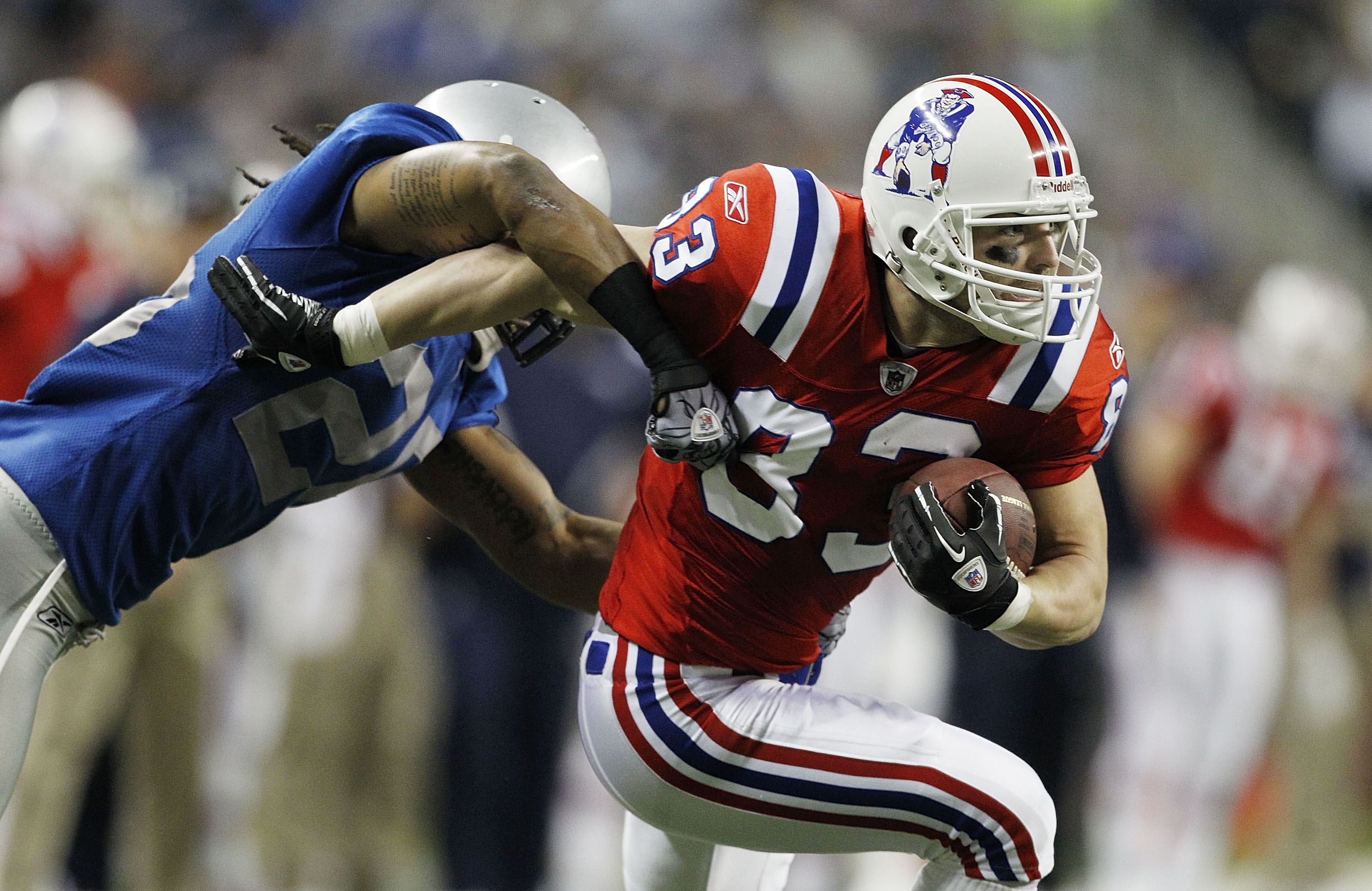 DETROIT - NOVEMBER 25:  Wes Welker #83 of the New England Patriots catches a pass for a first down as Louis Delmas #26 of the Detroit Lions makes the stop during the first quarter of the game at Ford Field on November 25, 2010 in Detroit, Michigan.  (Phot