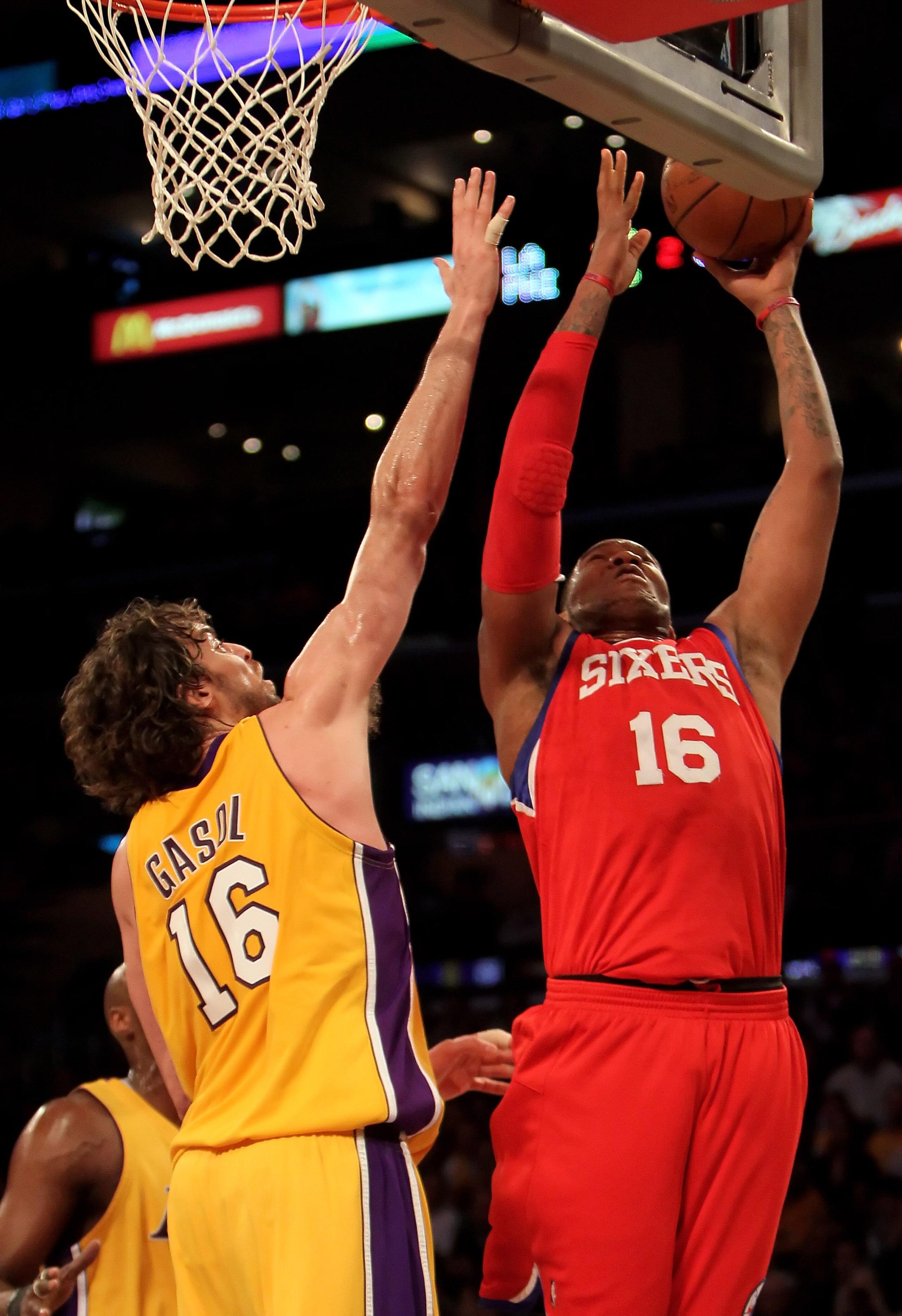 LOS ANGELES, CA - FEBRUARY 26:  Marreese Speights #16 of the Philadelphia 76ers drives to the basket while being defended by Pau Gasol #16 of the Los Angeles Lakers in the first half at Staples Center on February 26, 2010 in Los Angeles, California. The L