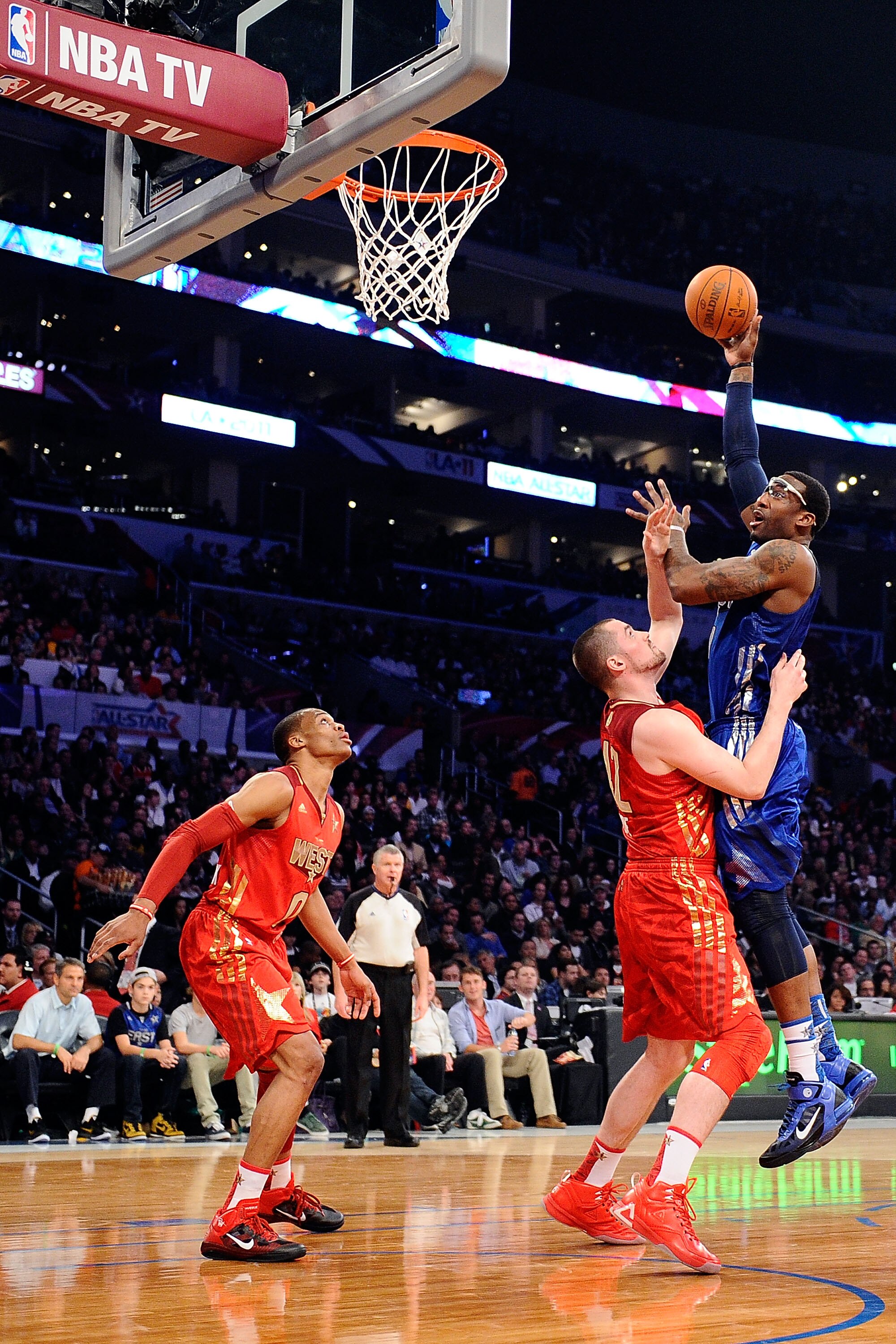 LOS ANGELES, CA - FEBRUARY 20:  Amare Stoudemire #1 of the New York Knicks and the Eastern Conference shoots over Kevin Love #42 of the Minnesota Timberwolves and the Western Conference in the first half of the 2011 NBA All-Star Game at Staples Center on