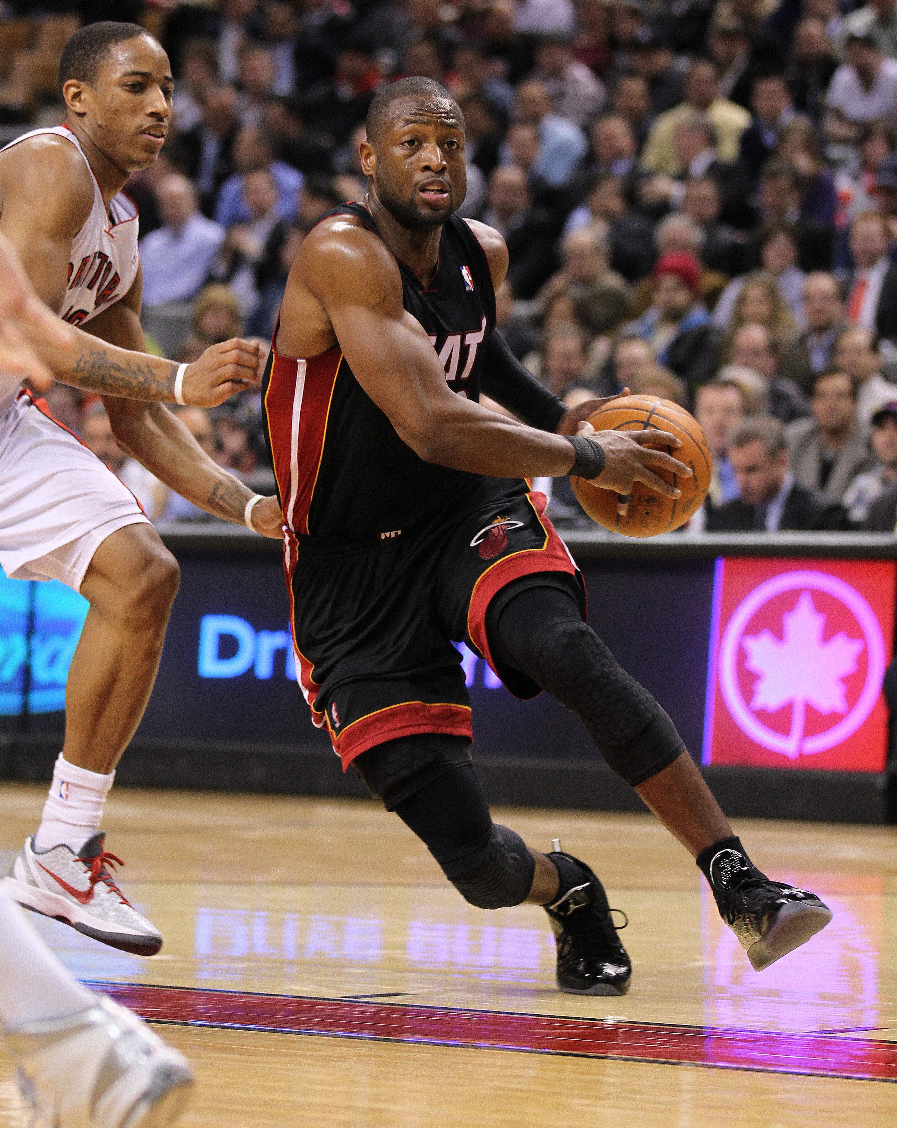 TORONTO, CAN - FEBRUARY 16: Dwayne Wade #3  of the Miami Heat drives around DeMar DeRozan #10 of the Toronto Raptors in a game on February 16, 2011 at the Air Canada Centre in Toronto, Canada. (Photo by Claus Andersen/Getty Images)
