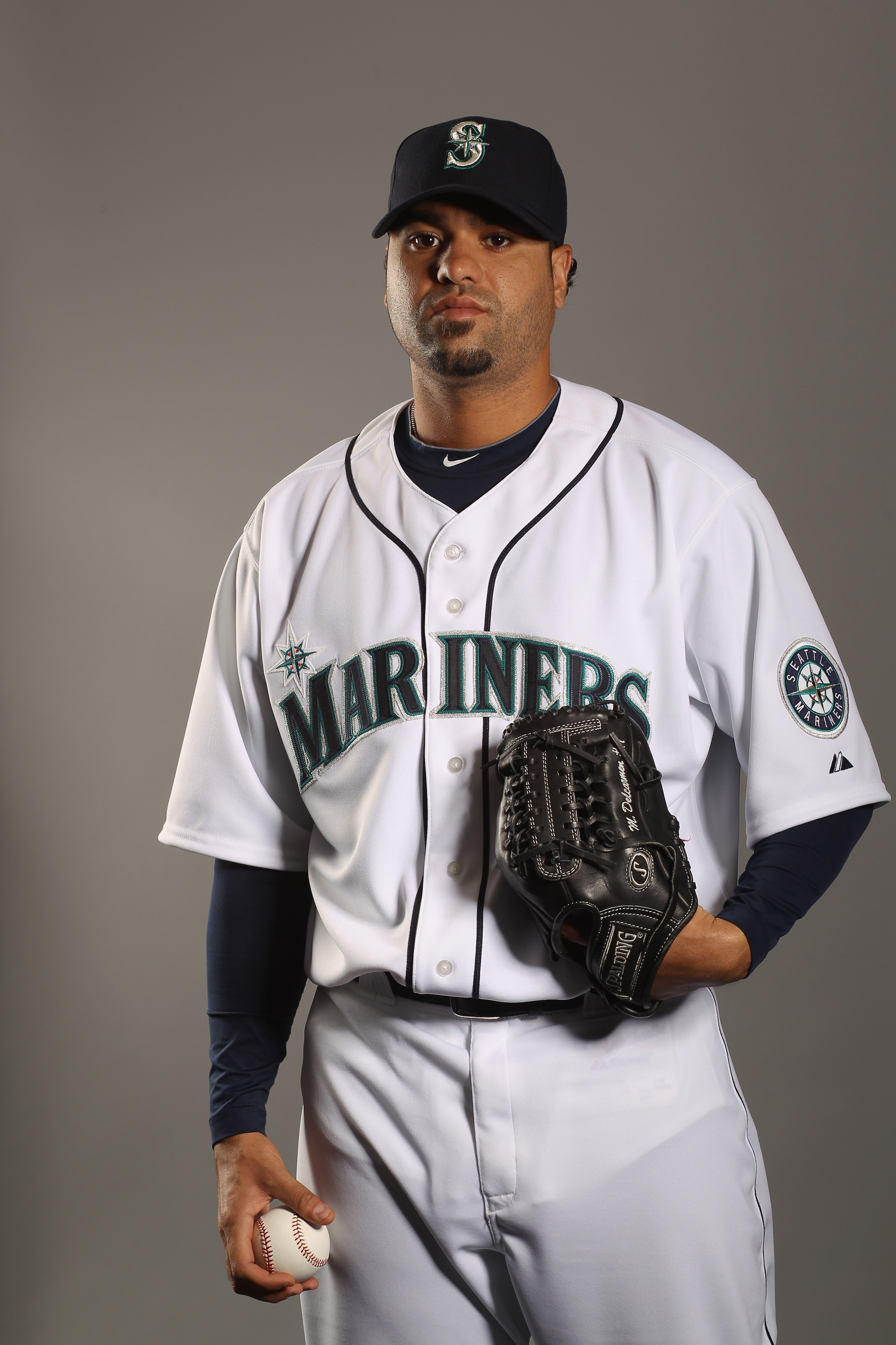 PEORIA, AZ - FEBRUARY 20: Manny Delcarmen #31 of the Seattle Mariners poses for a portrait at the Peoria Sports Complex on February 20, 2011 in Peoria, Arizona. (Photo by Ezra Shaw/Getty Images) PEORIA, AZ - FEBRUARY 20: Manny Delcarmen #31 of the Seattle Mariners poses for a portrait at the Peoria Sports Complex on February 20, 2011 in Peoria, Arizona. (Photo by Ezra Shaw/Getty Images)