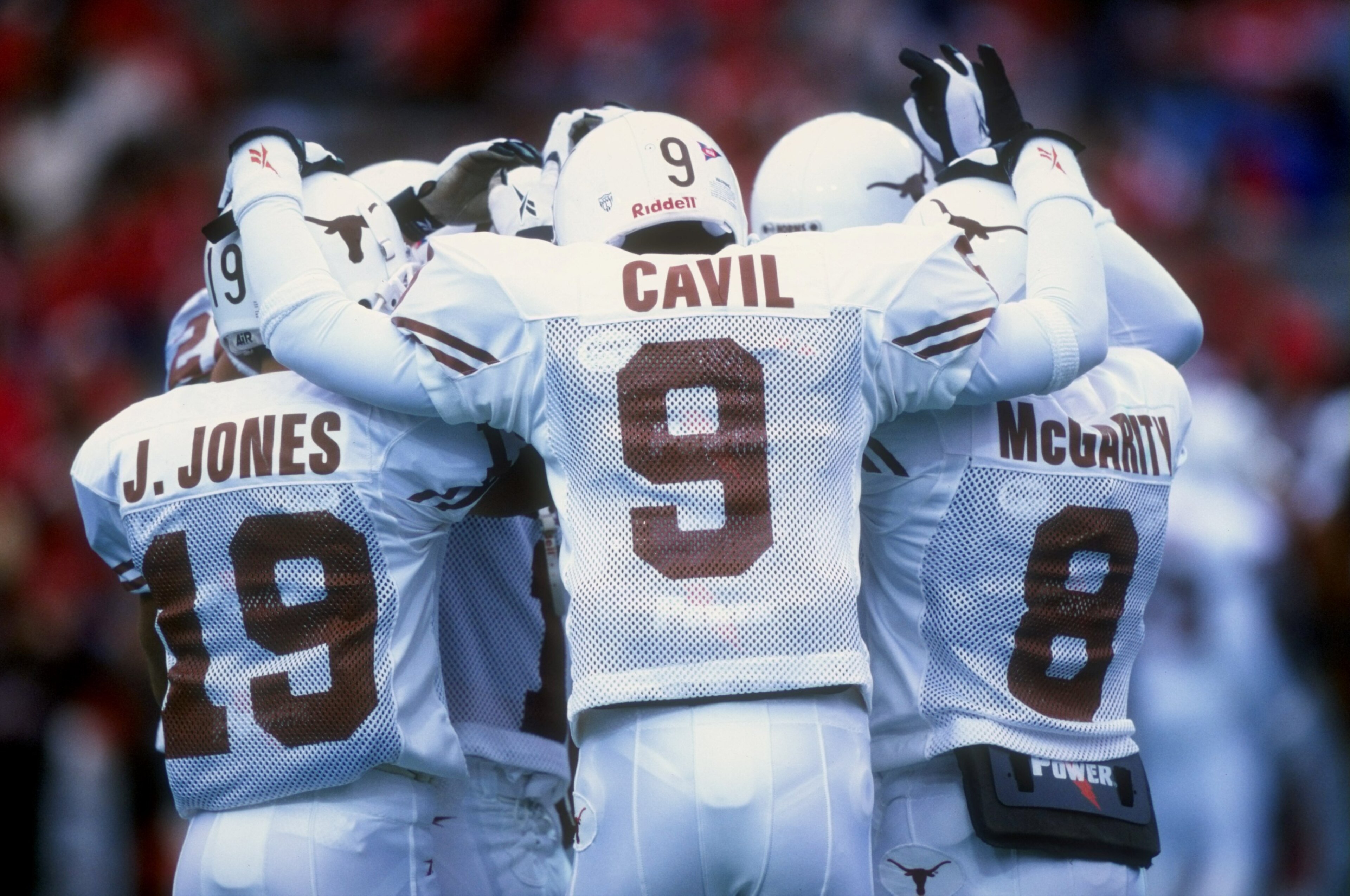 31 Oct 1998:  Kwame Cavil #9 of the Texas Longhorns stands in the huddle during a game against the Nebraska Cornhuskers at Memorial Stadium in Lincoln, Nebraska. Texas defeated Nebraska 20-16. Mandatory Credit: Brian Bahr  /Allsport
