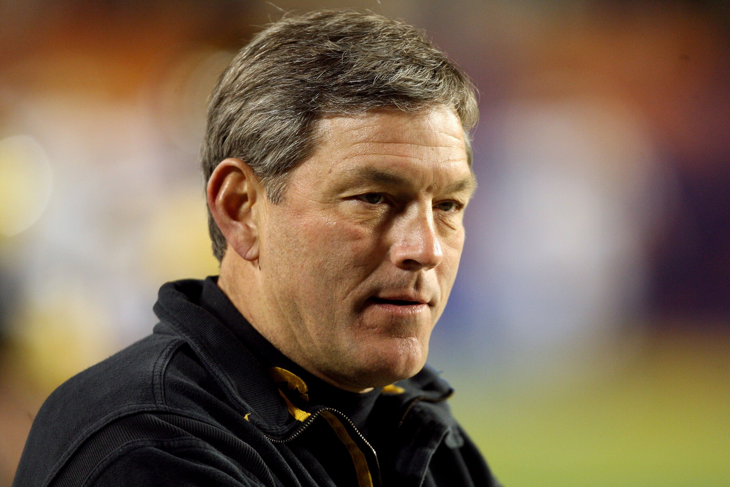 MIAMI GARDENS, FL - JANUARY 05:  Head coach Kirk Ferentz of the Iowa Hawkeyes looks on during warm ups against the Georgia Tech Yellow Jackets during the FedEx Orange Bowl at Land Shark Stadium on January 5, 2010 in Miami Gardens, Florida.  (Photo by Stre