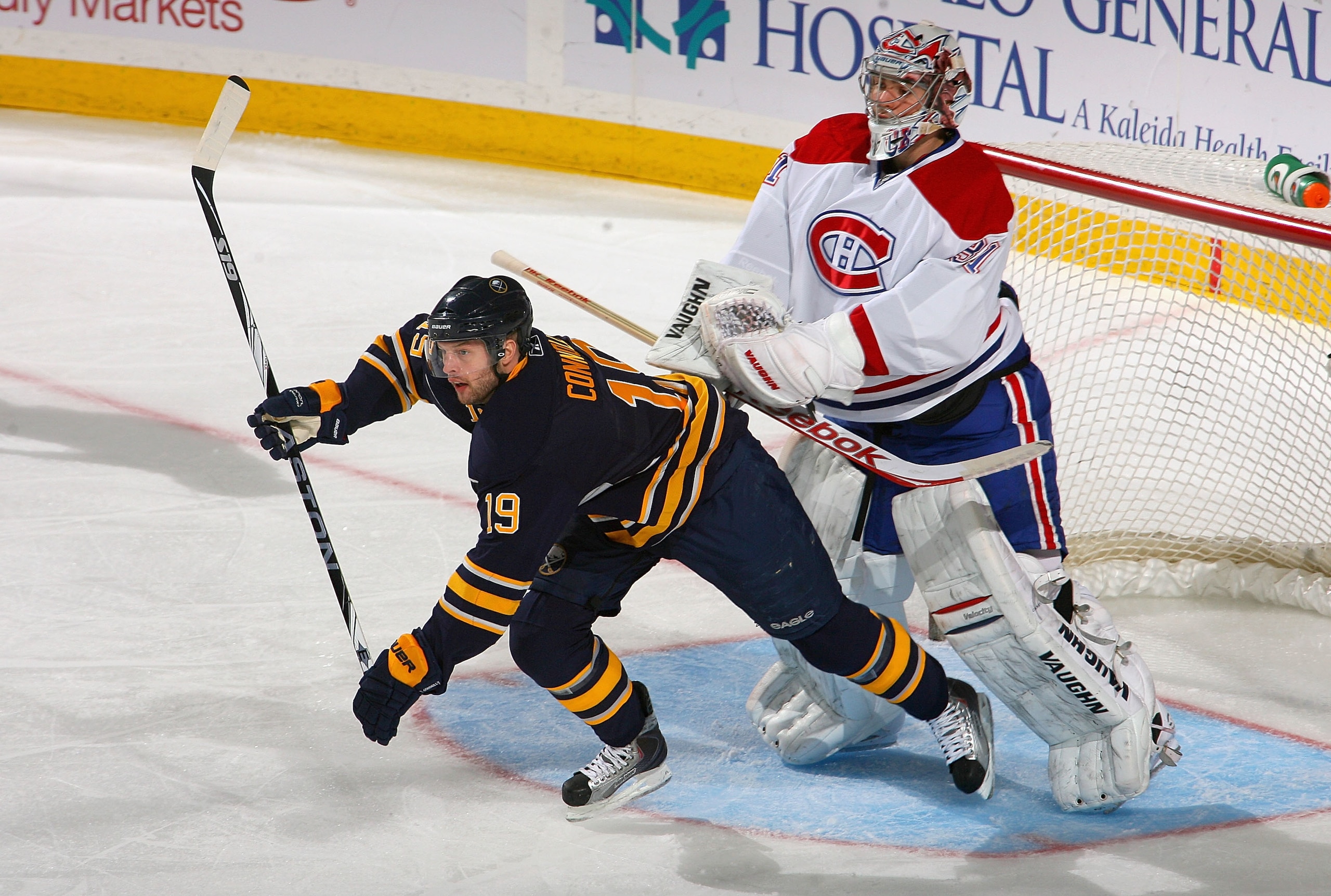 BUFFALO, NY - JANUARY 18: Tim Connolly #19 of the Buffalo Sabres is pushed by Carey Price #31 of the Montreal Canadiens at HSBC Arena on January 18, 2011 in Buffalo, New York.  (Photo by Rick Stewart/Getty Images)