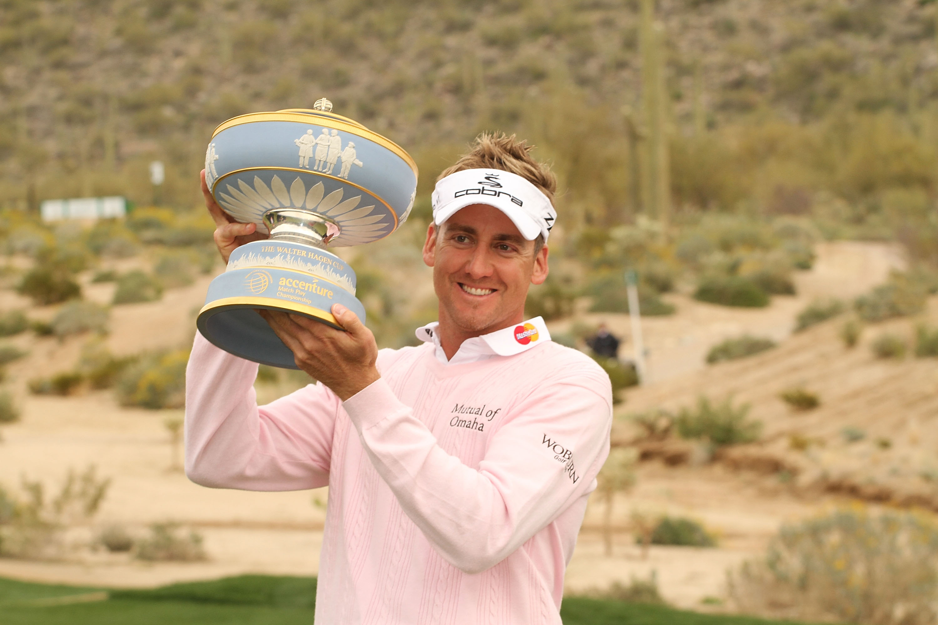 MARANA, AZ - FEBRUARY 21:  Ian Poulter of England lifts the Walter Hagen Cup trophy on the 16th hole after winning the final round of the Accenture Match Play Championship at the Ritz-Carlton Golf Club at  on February 21, 2010 in Marana, Arizona.  (Photo