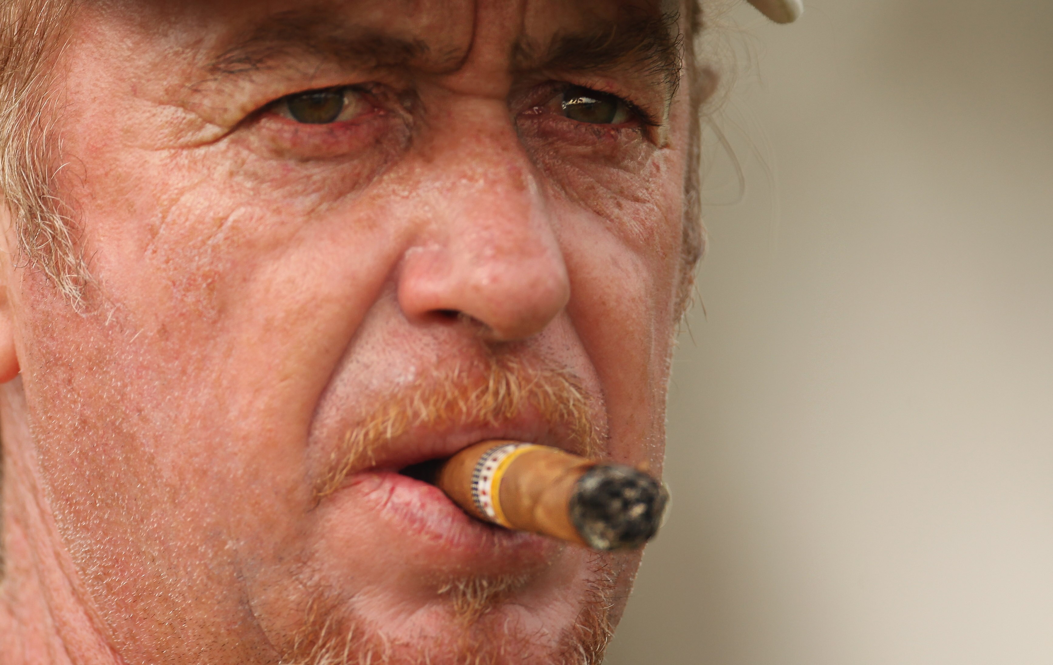 DUBAI, UNITED ARAB EMIRATES - FEBRUARY 9:  Miguel Angel Jimenez of Spain looks on during the pro-am for the 2011 Omega Dubai desert Classic held on the Majilis Course at the Emirates Golf Club on February 9, 2011 in Dubai, United Arab Emirates.  (Photo by