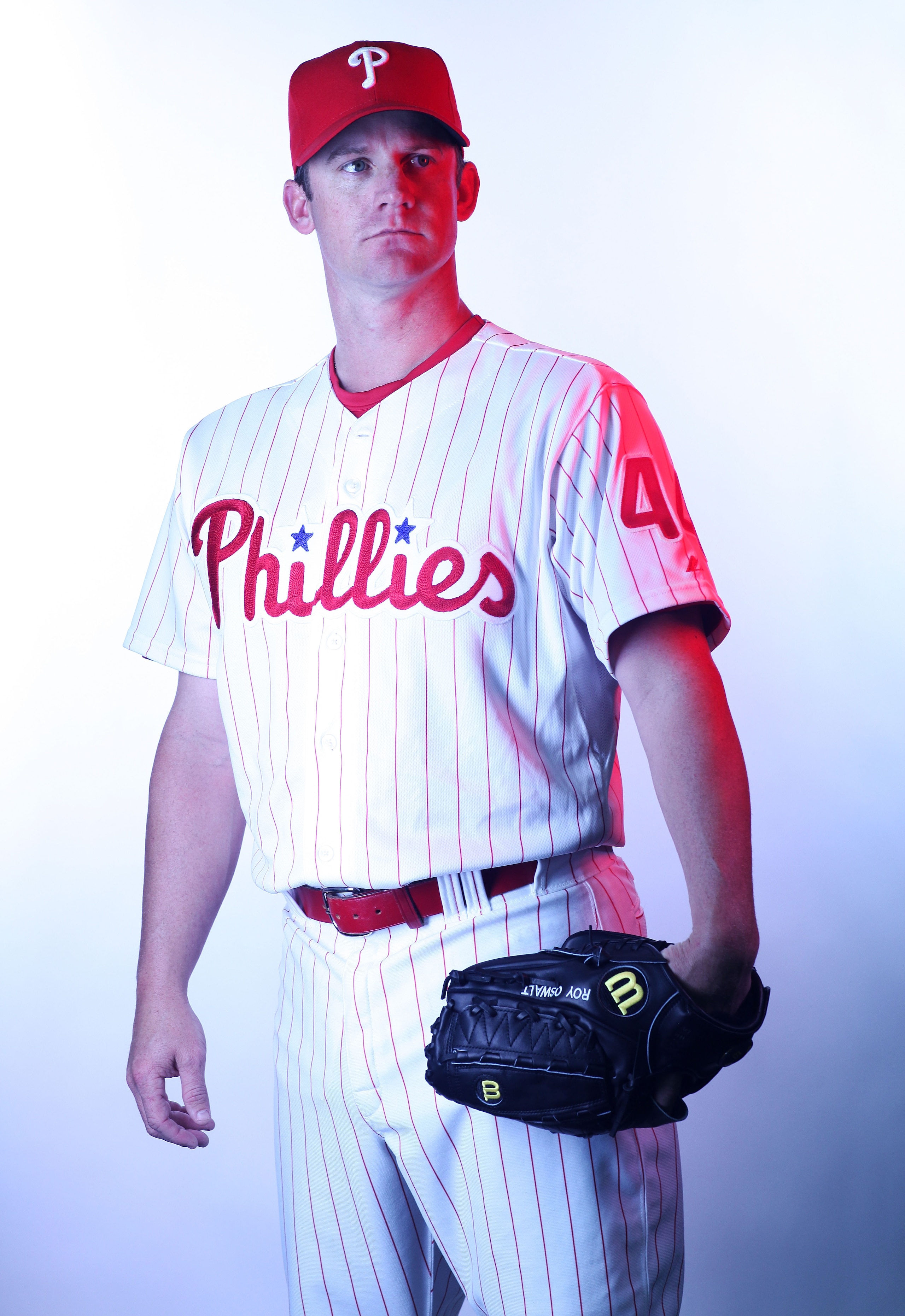 CLEARWATER, FL - FEBRUARY 22:  (EDITORS NOTE: Image was shot with a colored gel on lights) Roy Oswalt #44 of the Philadelphia Phillies poses for a photo during Spring Training Media Photo Day at Bright House Networks Field on February 22, 2011 in Clearwat