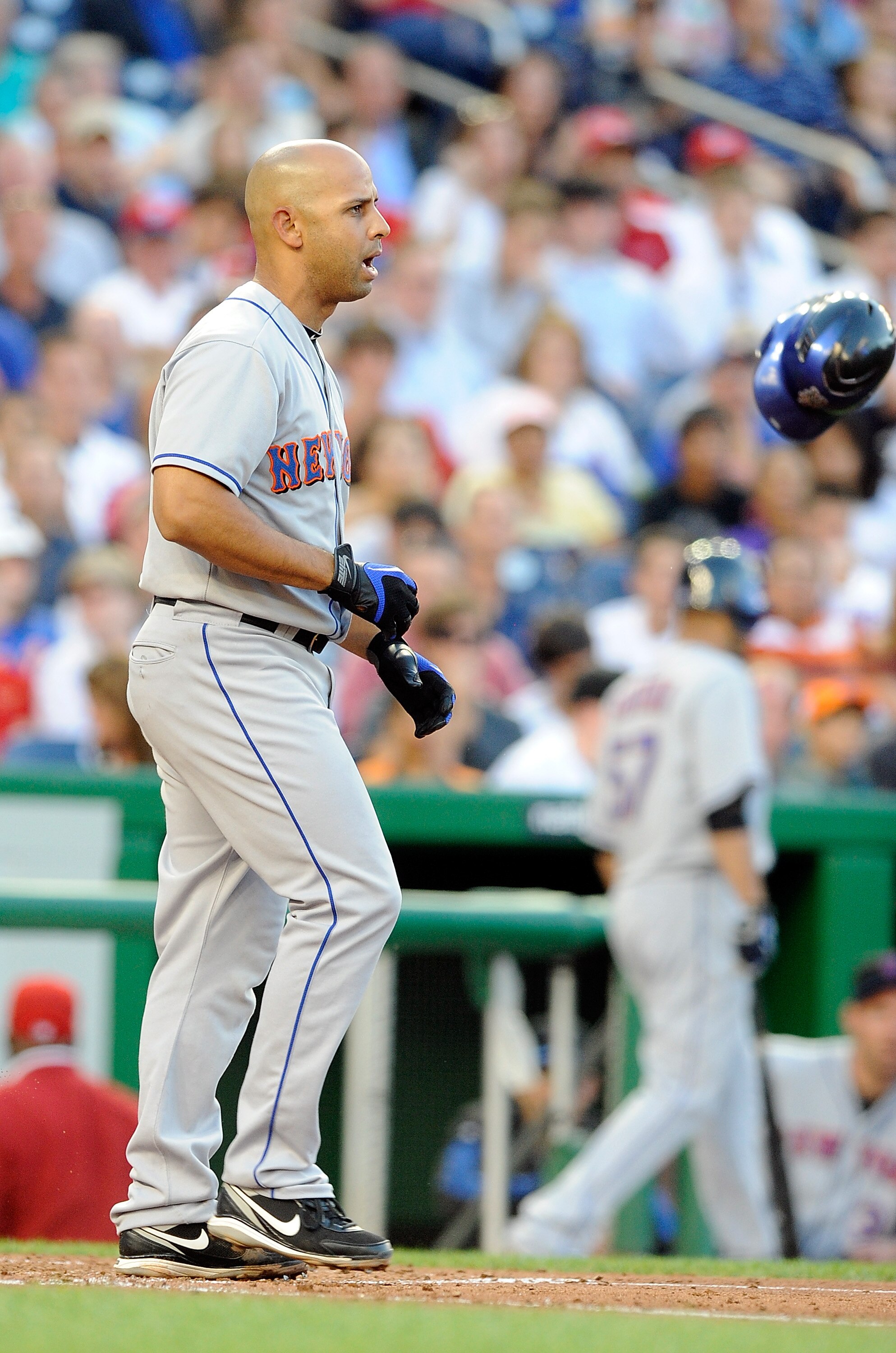 WASHINGTON - JULY 01:  Alex Cora #13 of the New York Mets throws his helmet after striking out against the Washington Nationals at Nationals Park on July 1, 2010 in Washington, DC.  (Photo by Greg Fiume/Getty Images)