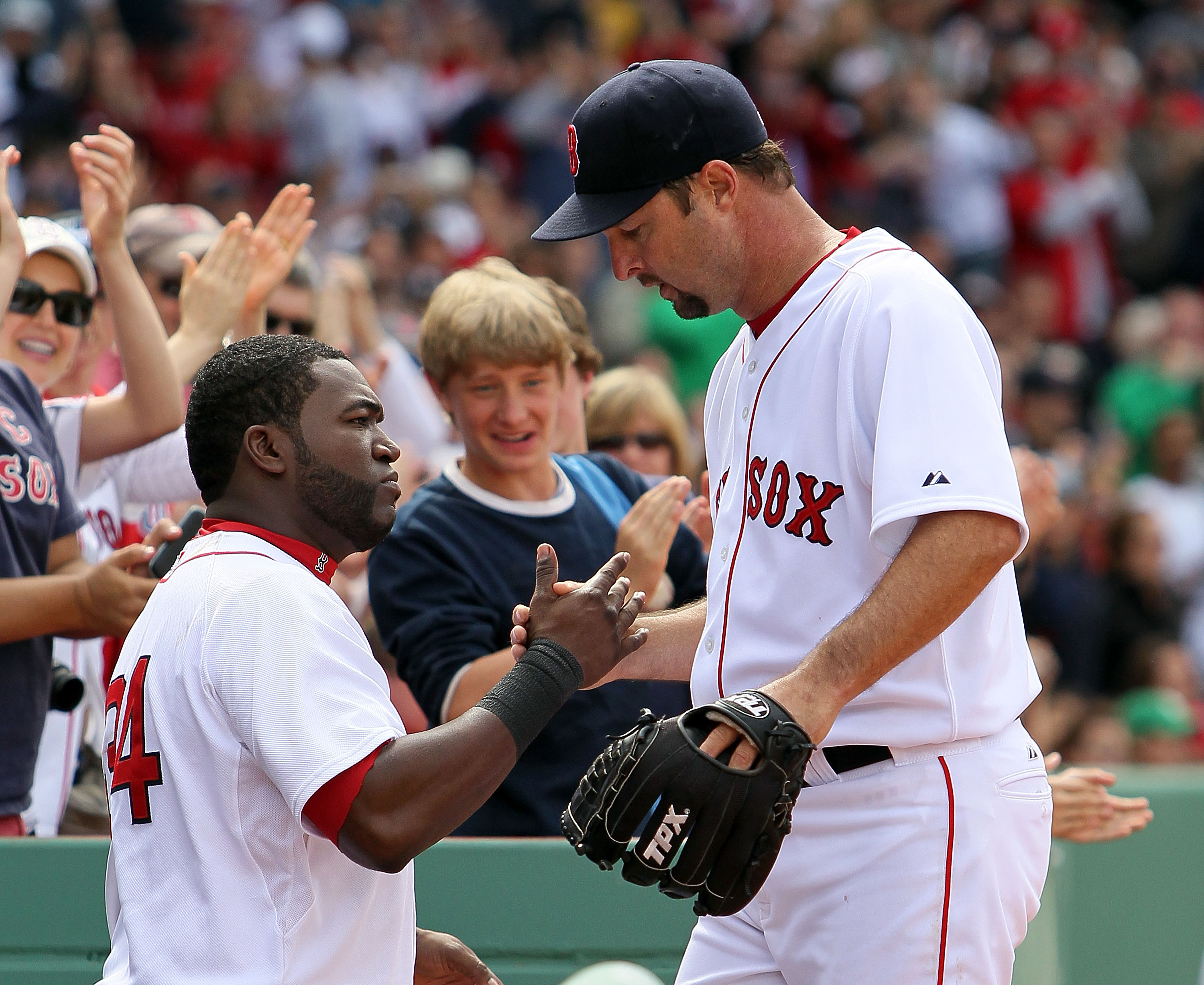 BOSTON - APRIL 25: David Ortiz #34 and Tim Wakefield #49 of the Boston Red Sox share a moment against the Baltimore Orioles at Fenway Park on April 25, 2010 in Boston, Massachusetts.  (Photo by Jim Rogash/Getty Images)