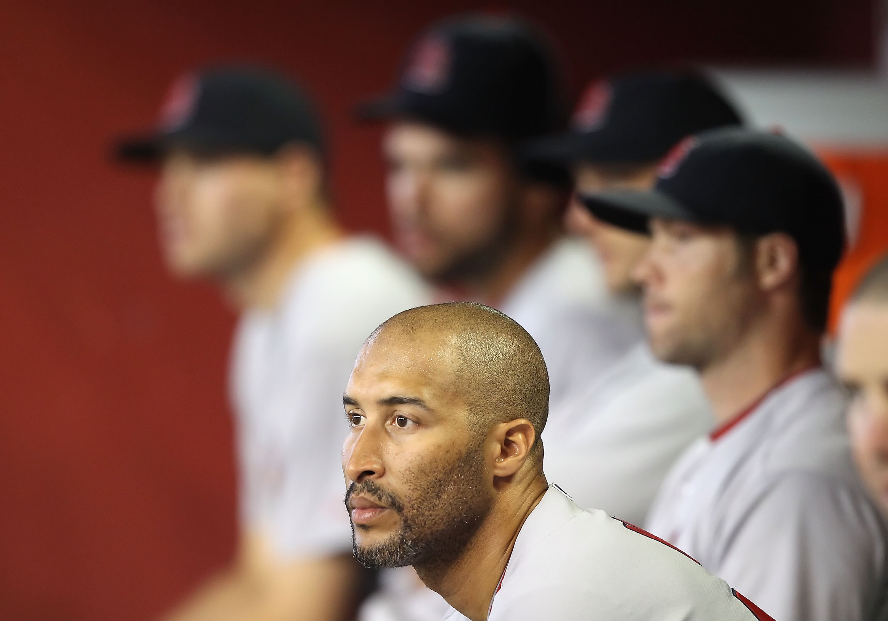 PHOENIX - JUNE 13:  Randy Winn #44 of the St. Louis Cardinals looks on with teammates in the dugout during the Major League Baseball game against the Arizona Diamondbacks at Chase Field on June 13, 2010 in Phoenix, Arizona. The Diamondbacks defeated the C