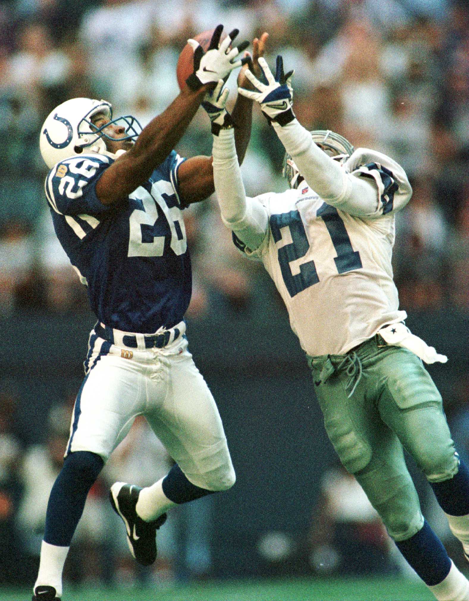 15 Sep 1996:  Defensive back Dedric Mathis #26 of the Indianapolis Colts battles for the football with wide receiver Deion Sanders #21 of the Dallas Cowboys in last minute of the fourth quarter during the Colts 25-24 victory over the Cowboys at Texas Stad