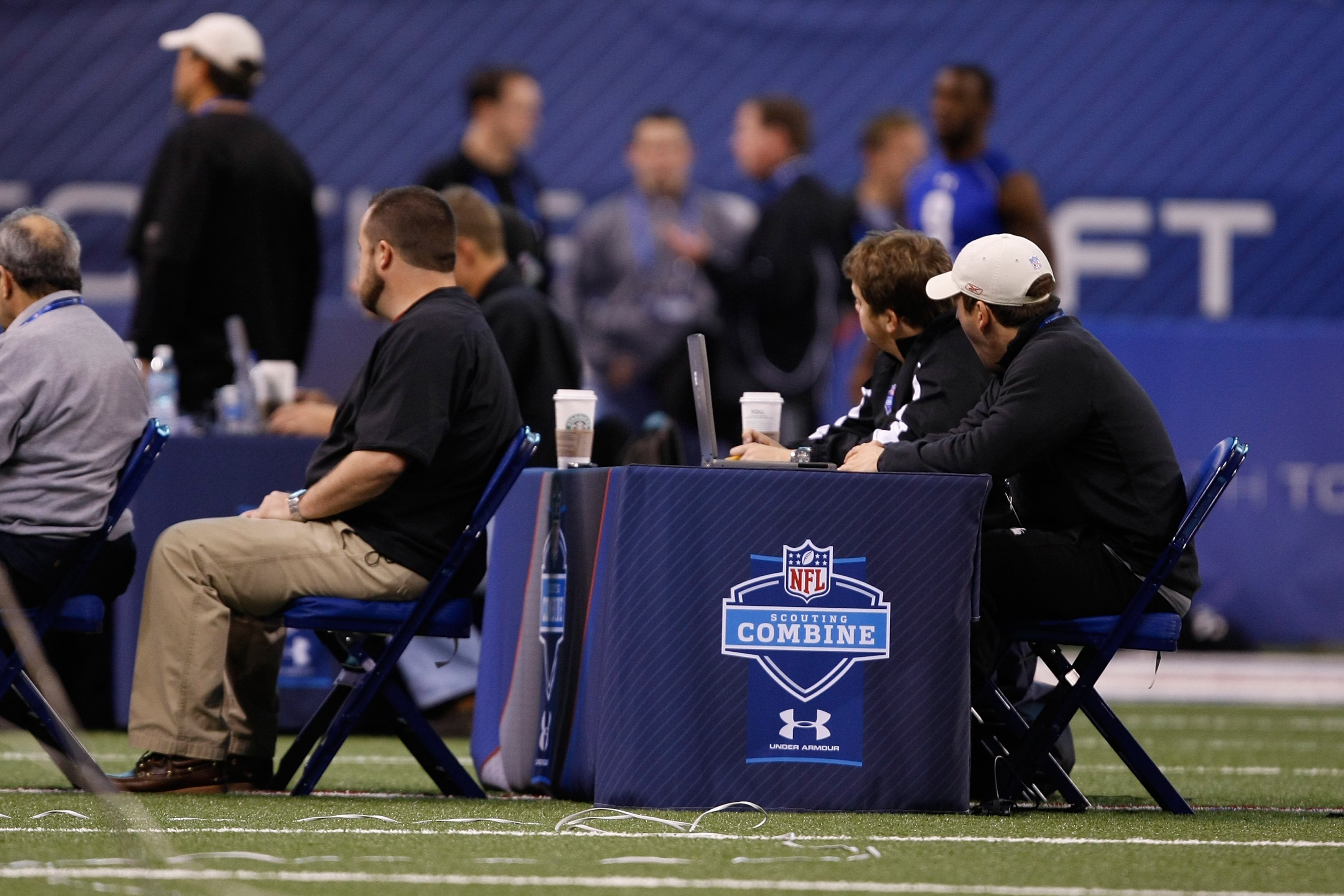 INDIANAPOLIS, IN - MARCH 2: Coaches evaluate players during the NFL Scouting Combine presented by Under Armour at Lucas Oil Stadium on March 2, 2010 in Indianapolis, Indiana. (Photo by Scott Boehm/Getty Images)