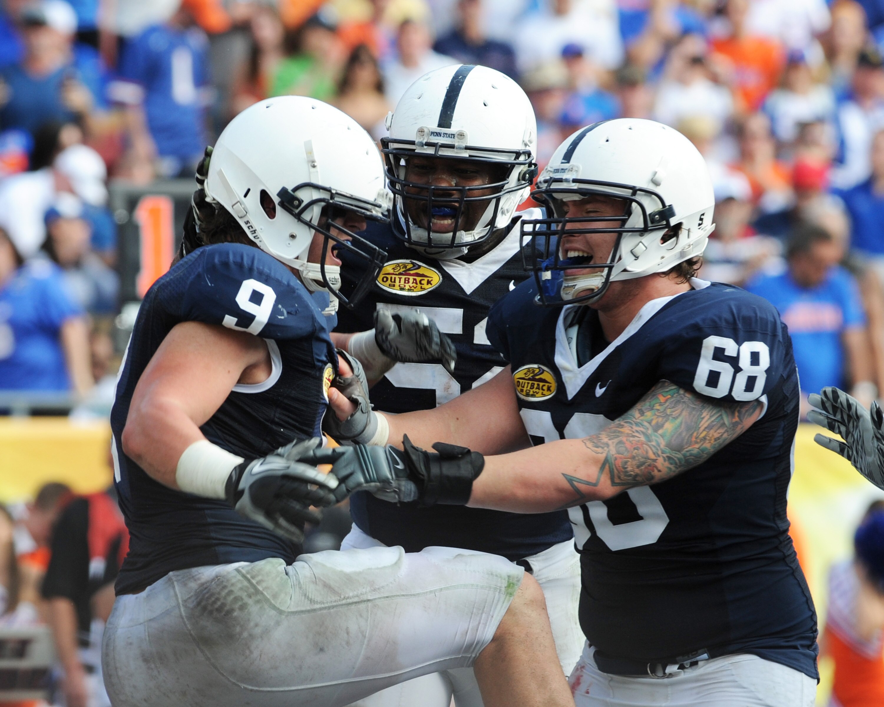 TAMPA, FL - JANUARY 1: Running back Michael Zordich #9 of the Penn State Nittany Lions celebrates a score with center Doug Klopacz #68 against the Florida Gators January 1, 2010 in the 25th Outback Bowl at Raymond James Stadium in Tampa, Florida. (Photo TAMPA, FL - JANUARY 1: Running back Michael Zordich #9 of the Penn State Nittany Lions celebrates a score with center Doug Klopacz #68 against the Florida Gators January 1, 2010 in the 25th Outback Bowl at Raymond James Stadium in Tampa, Florida. (Photo