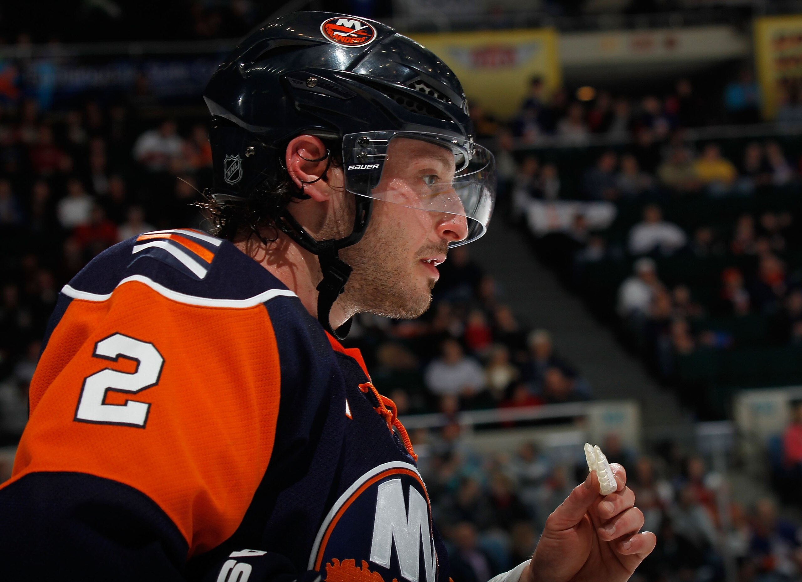 UNIONDALE, NY - MARCH 25: Defenseman Mark Streit # 2 of the New York Islanders holds his mouthpiece during a break in play in an NHL game against the Calgary Flames at the Nassau Coliseum on March 25, 2010 in Uniondale, New York.  (Photo by Paul Bereswill