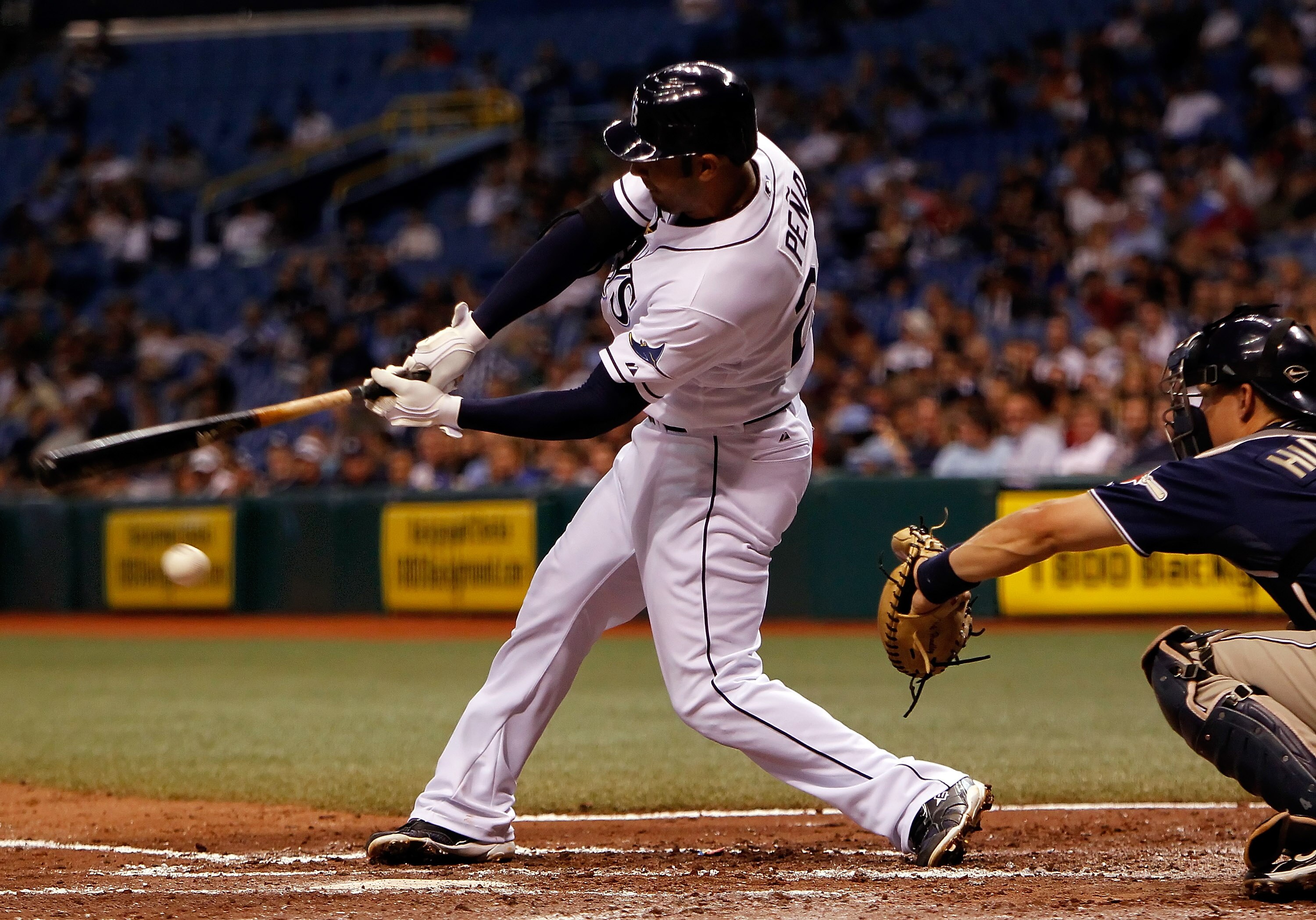 ST. PETERSBURG - JUNE 22:  First baseman Carlos Pena #23 of the Tampa Bay Rays fouls off a pitch against the San Diego Padres during the game at Tropicana Field on June 22, 2010 in St. Petersburg, Florida.  (Photo by J. Meric/Getty Images)