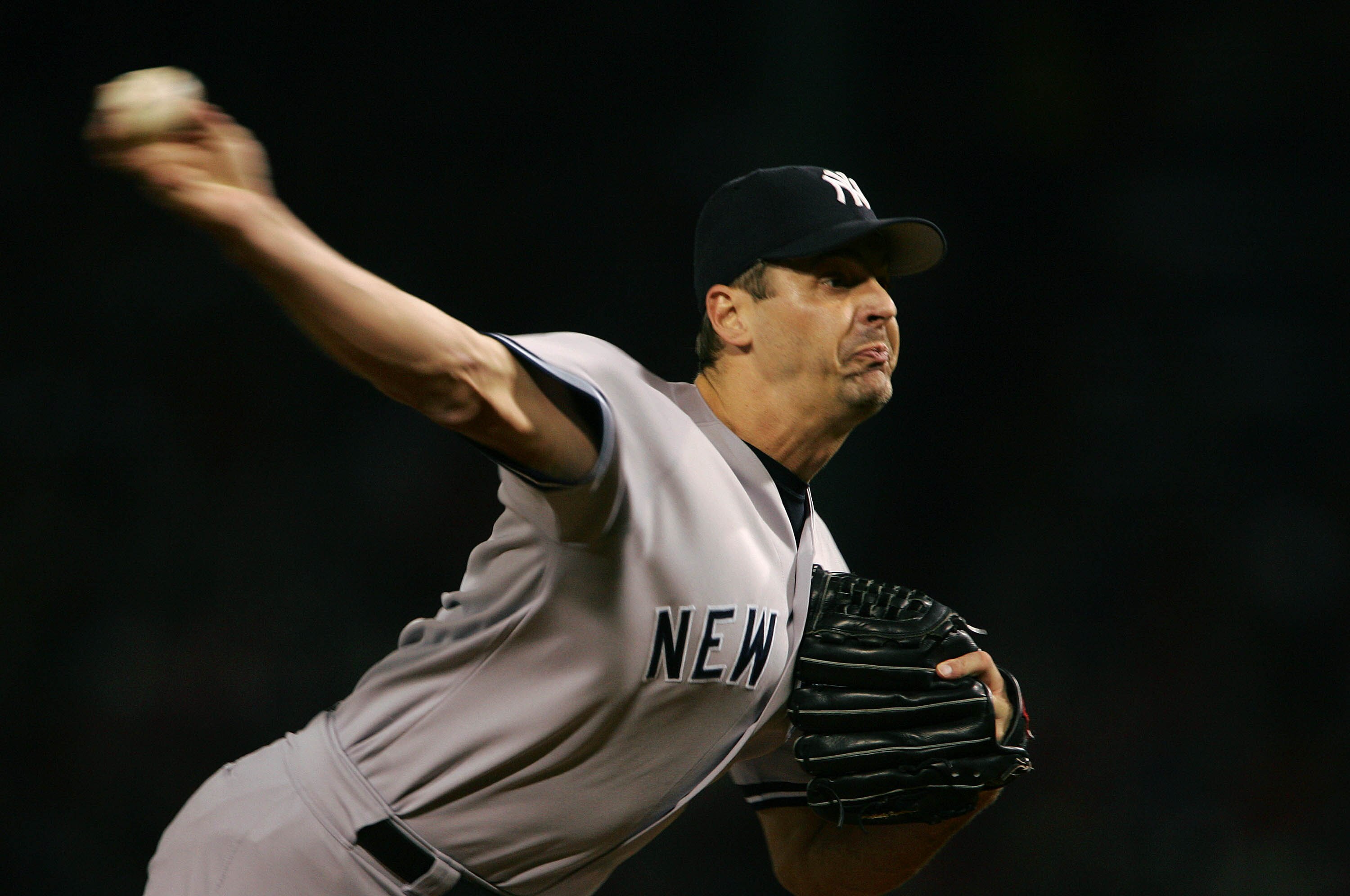 BOSTON - OCTOBER 16:  Pitcher Kevin Brown #27 of the New York Yankees throws a pitch against the Boston Red Sox in the first inning during game three of the American League Championship Series on October 16, 2004 at Fenway Park in Boston, Massachusetts.