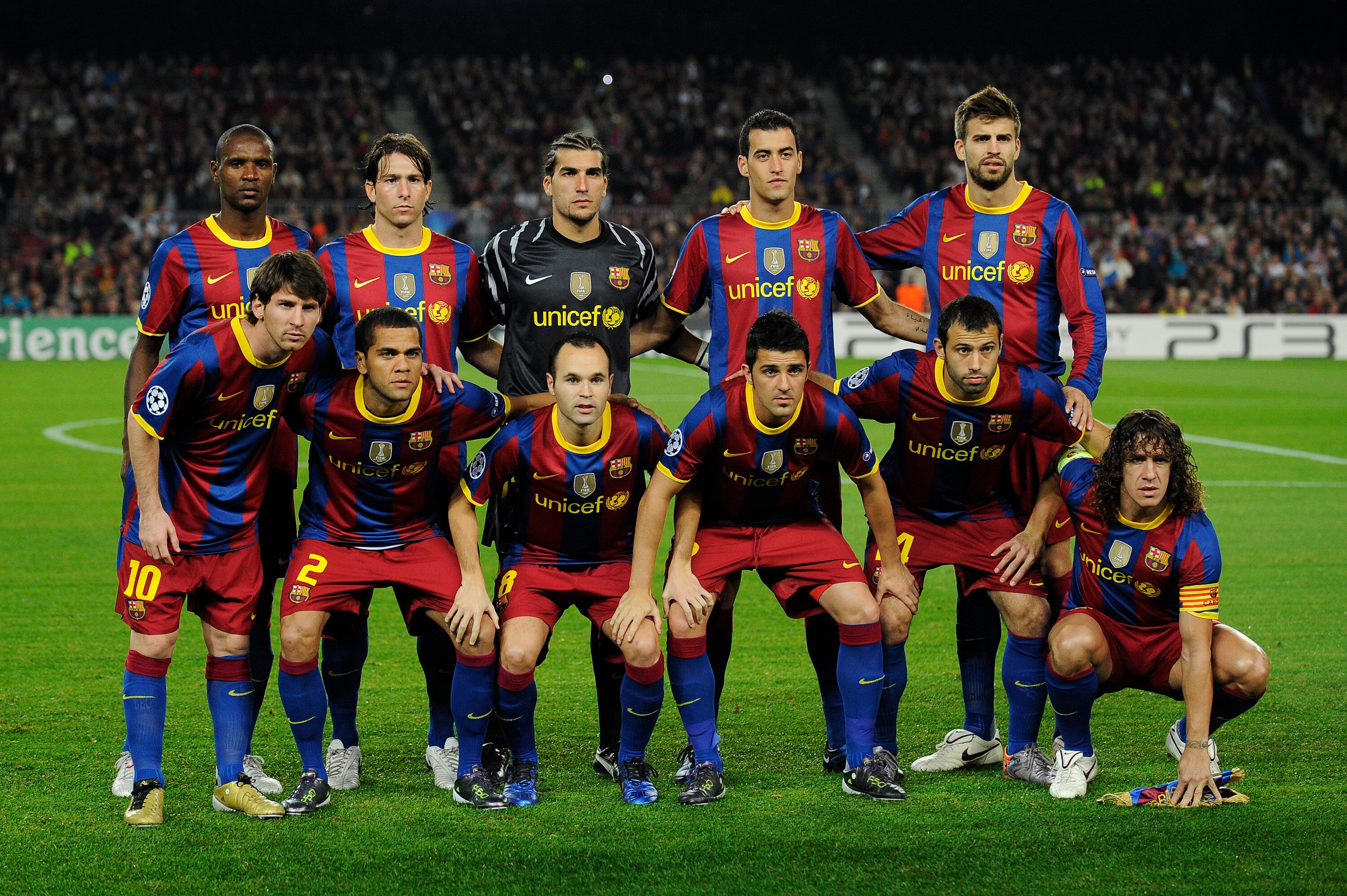BARCELONA, SPAIN - OCTOBER 20:  Barcelona players (From L-R) Eric Abidal, Lionell Messi, Maxwell, Daniel Alves, Jose Pinto, Andres Iniesta, David Villa, Sergio Busquets, Javier Mascherano, Gerard Pique, Carles Puyol pose for a team picture during the UEFA