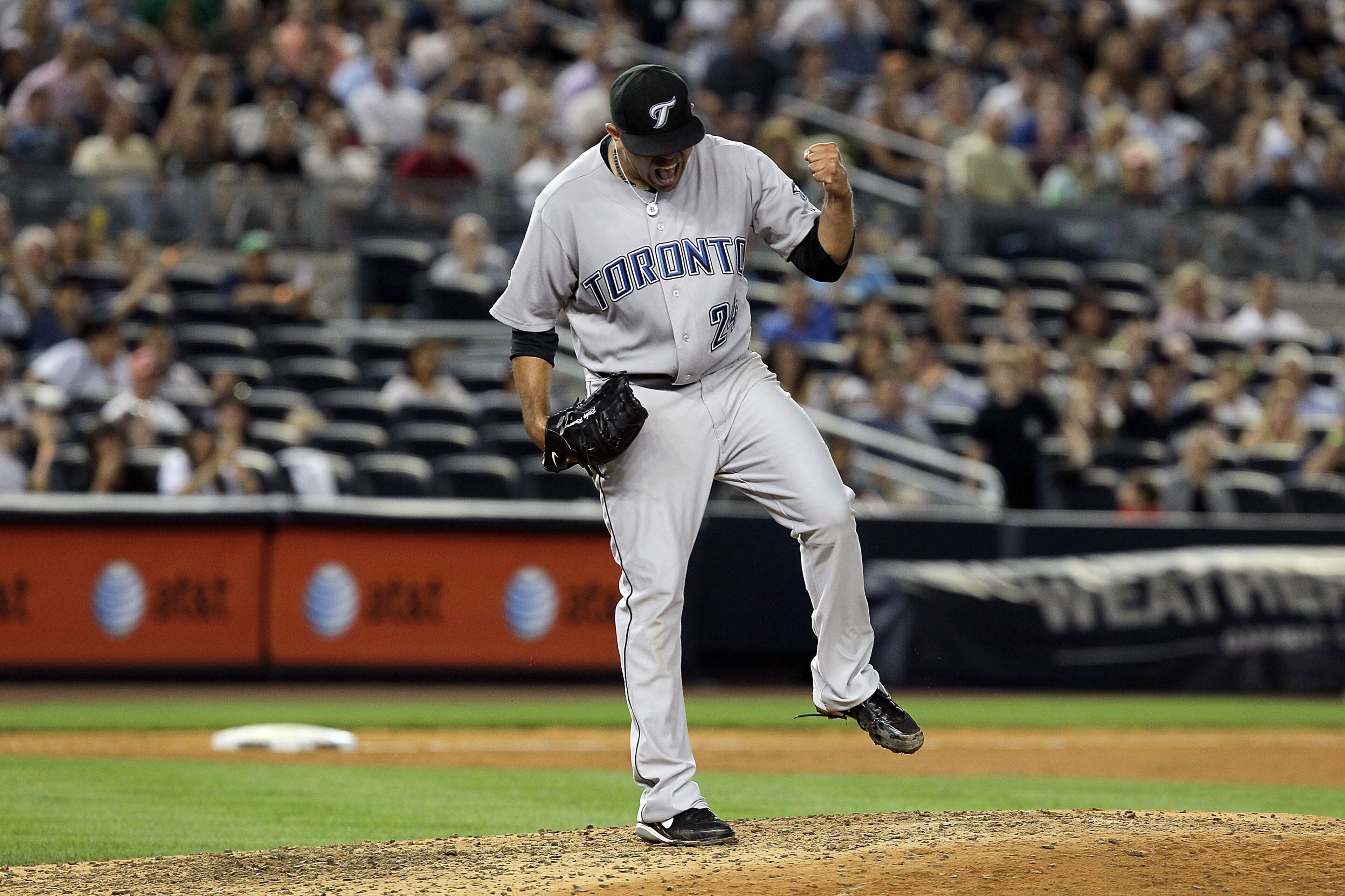 NEW YORK - AUGUST 03:  Ricky Romero #24 of the Toronto Blue Jays celebrates the final out against the New York Yankees on August 3, 2010 at Yankee Stadium in the Bronx borough of New York City.The Jays defeated the Yankees 8-2.  (Photo by Jim McIsaac/Gett